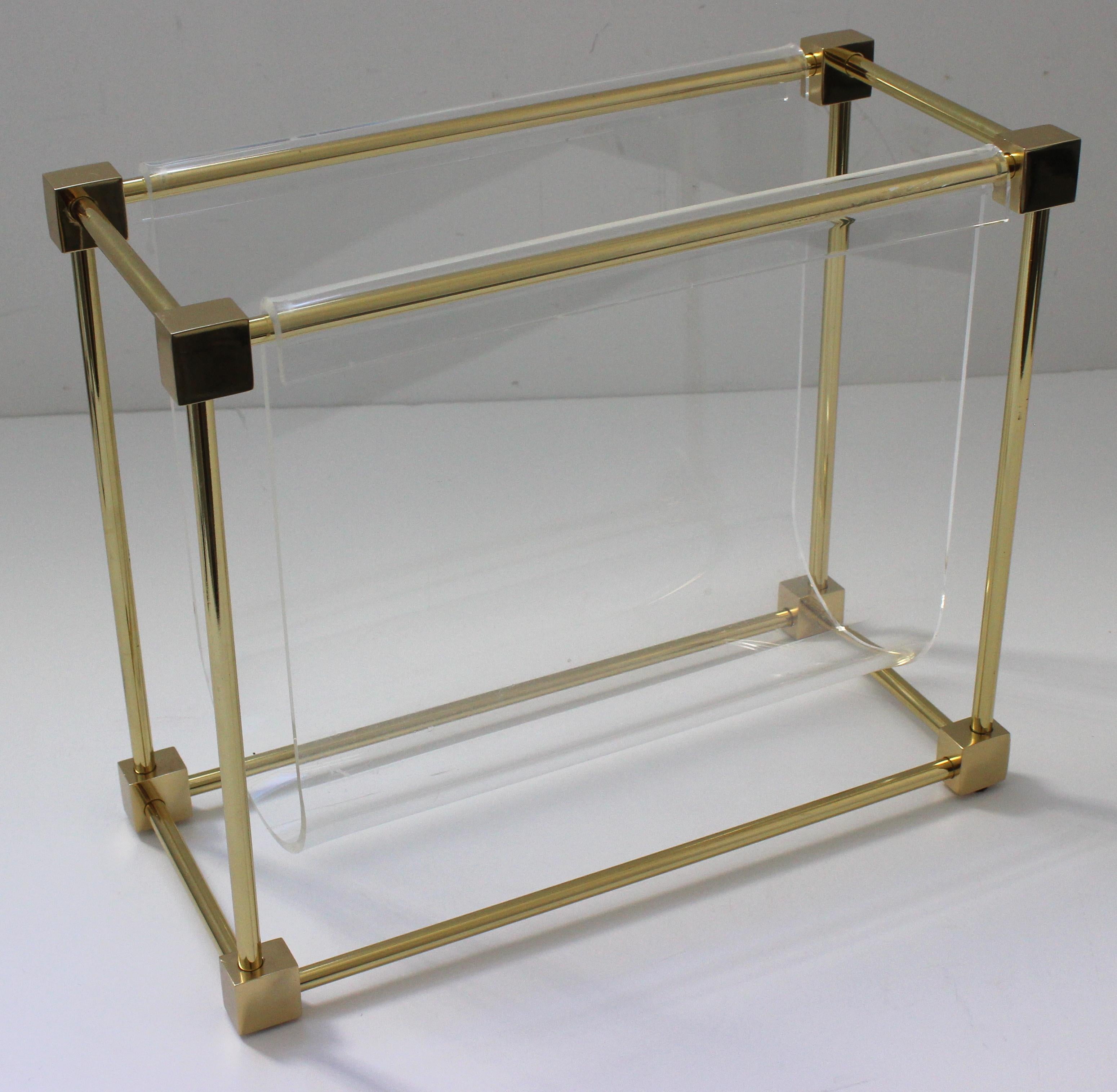 This stylish and chic lucite and brass magazine holder was created in the late 1970s and was designed by the American furniture designer Charles Hollis Jones.

Note: The brass has been professionally polished and finished with a clear lacquer (so