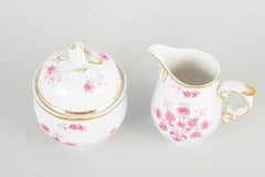 Hollóháza, Hungary. Creamer and lidded sugar bowl in porcelain. Mid-20th C.