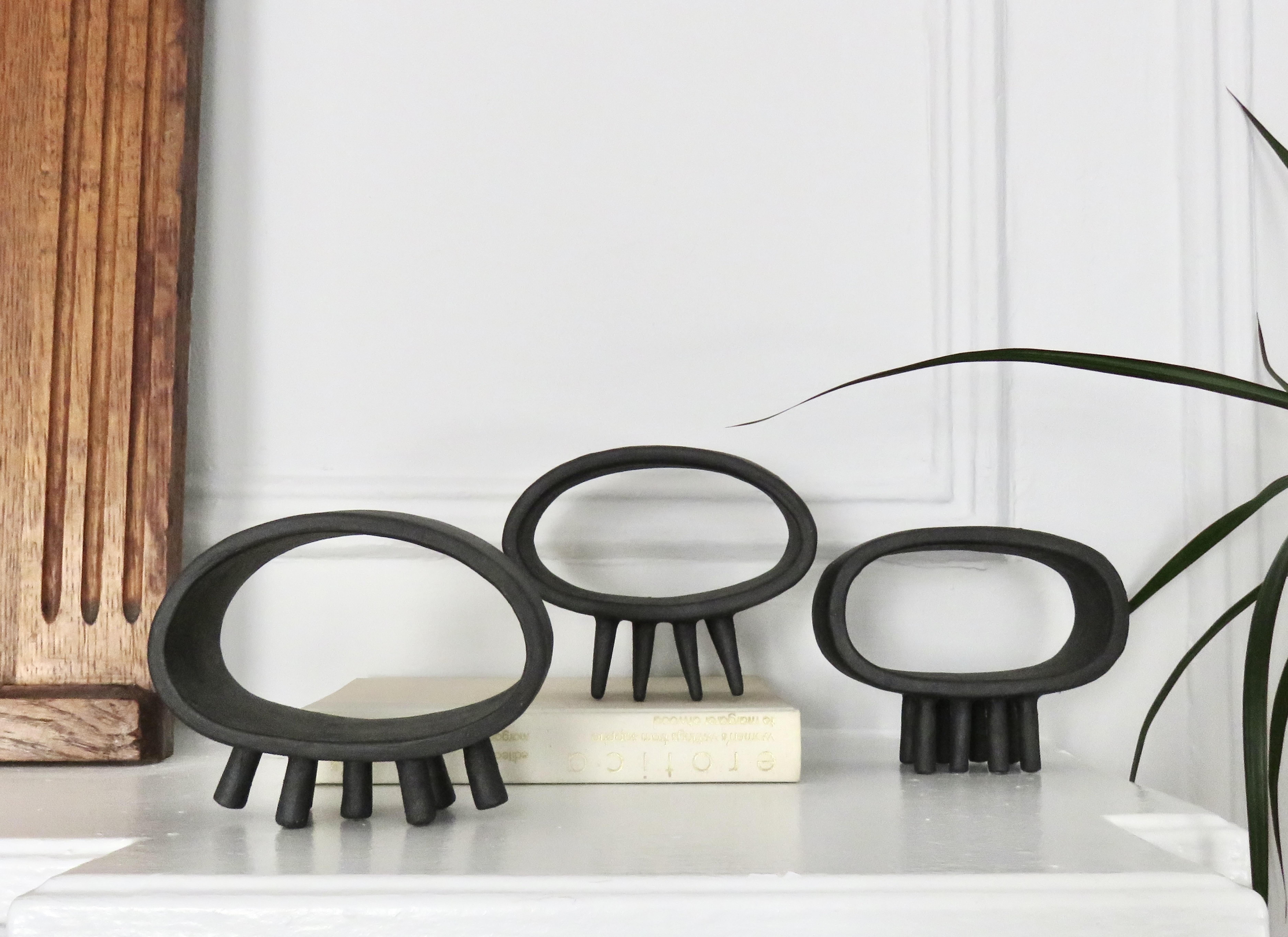Hollow Black Rectangular Ceramic Sculpture on Eight Slender Feet For Sale 9