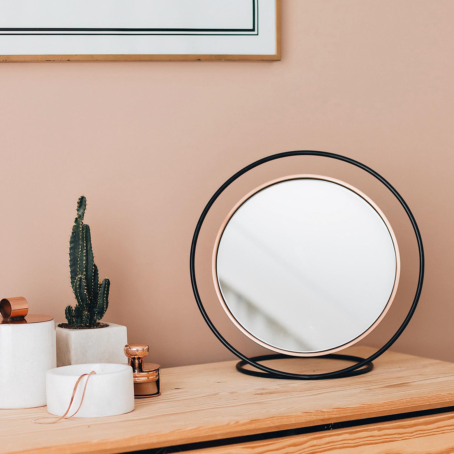Hollow, creates a beautiful illusion through geometry and design. Metal circular frame acts as a stand for the mirror by creating a deception as if its floating in the air. Hollow acts as a functional object as well as an attractive decorative