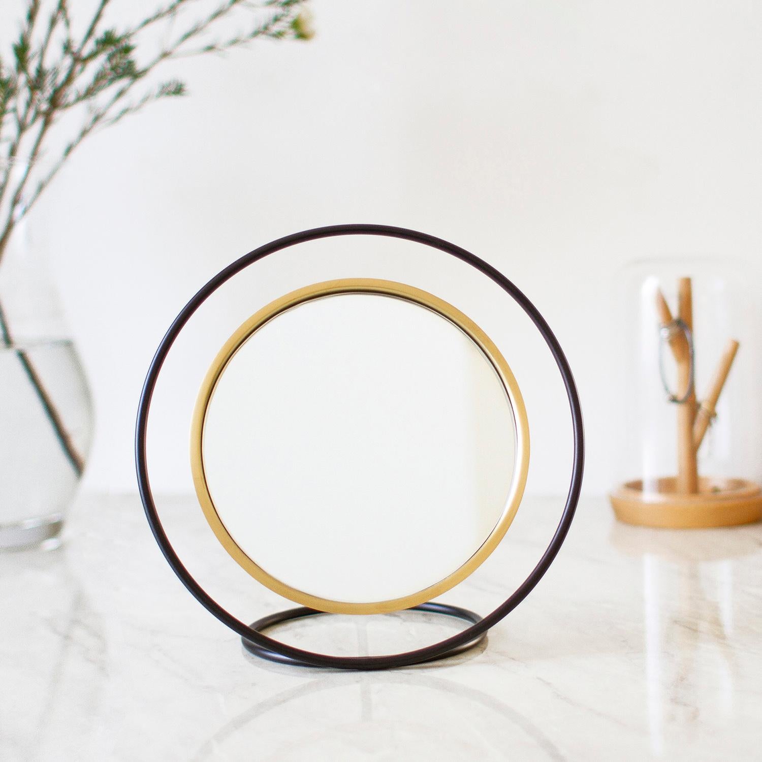 Hollow, creates a beautiful illusion through geometry and design. Metal circular frame acts as a stand for the mirror by creating a deceiption as if its floating in the air. Hollow acts as a functional object as well as an attractive decorative