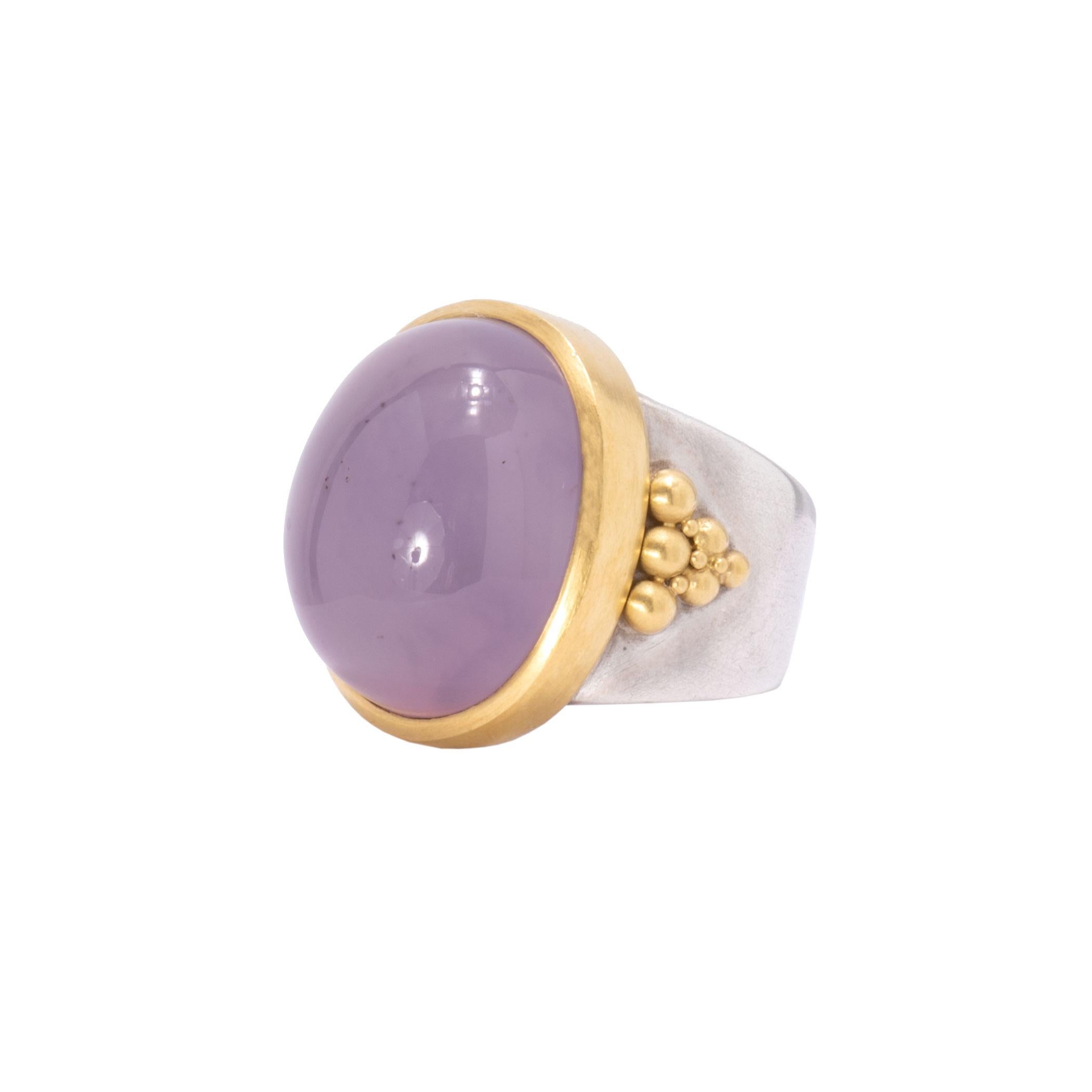 Holly Agate is a soft blue or purple toned stone and this specimen of 36.75cts is simply mesmerizing. The Holly Agate Dome Ring is set into a high 22k bezel and mounted on a wide, tapering shank in sterling silver. A cornucopia of 22k beads trickle