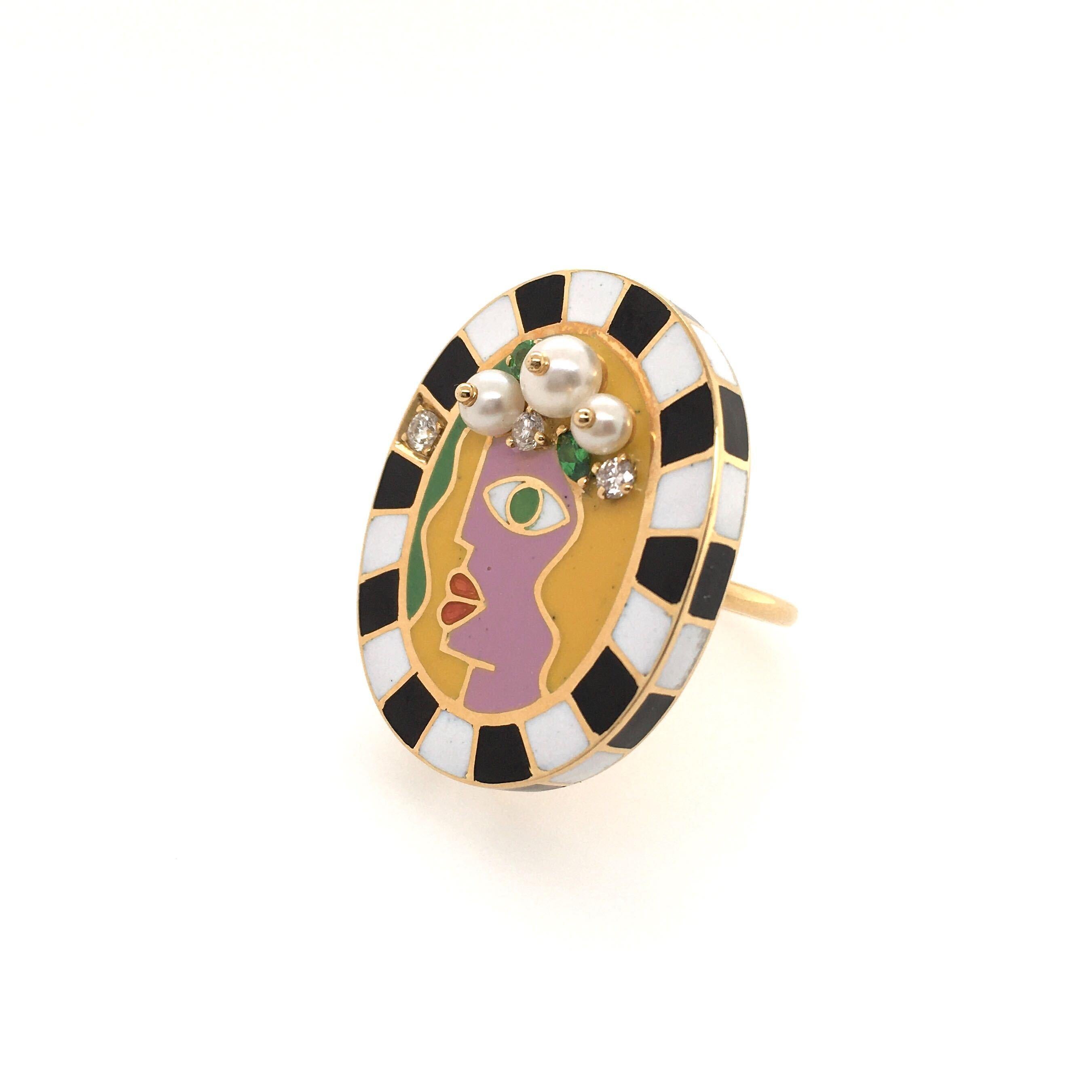 An 18 karat yellow gold, enamel gem set and diamond Face ring. Holly Dyment. Designed as a woman in profile, in pink, yellow, green and orange enamel, wearing a crown of seed pearls, green garnets and diamonds, within a black and white enamel