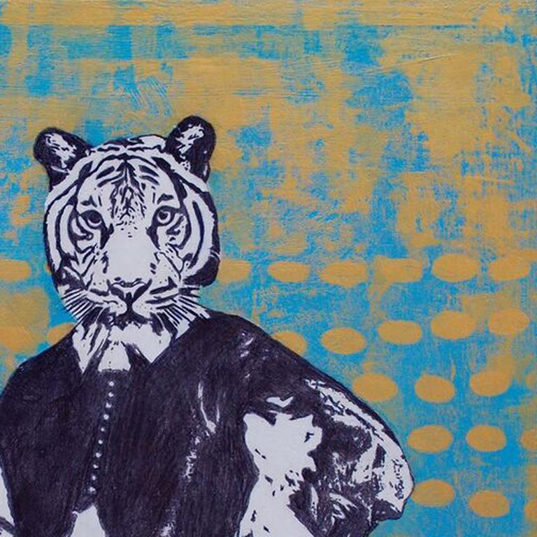 Holly Harrison's mixed media piece on panel portrays a tiger in the traditional portrait style. The black and white photo transfer of the tiger boldly contrasts with the gold and blue paint of the background. The background is remanent of jewel