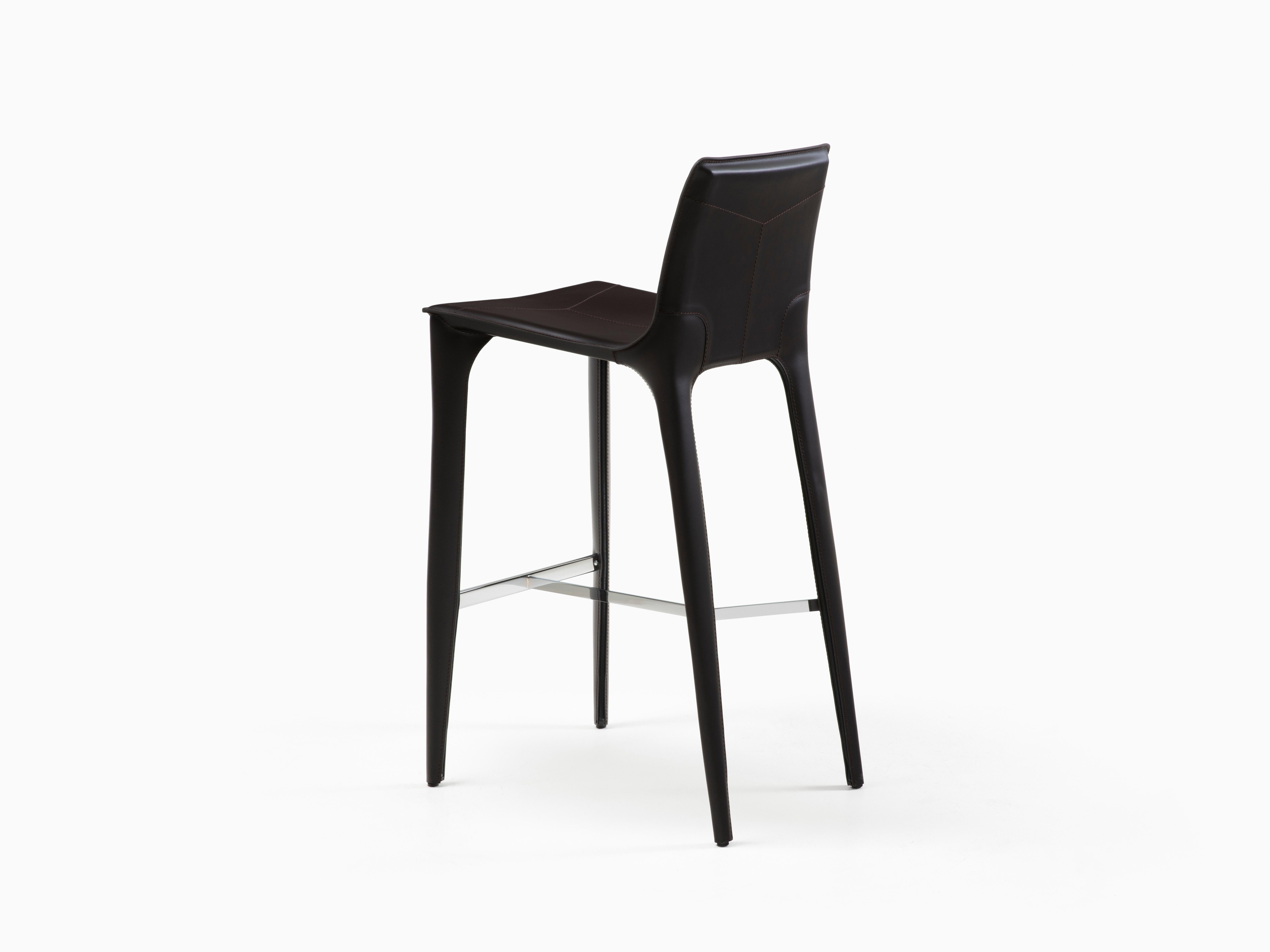 HOLLY HUNT Adriatic bar stool in polished chrome and caffe leather finish. This simple and elegant bar stool is covered in Italian saddle Leather. From the slightly curved back and slender legs, the lines of this chair flow one into the next for a