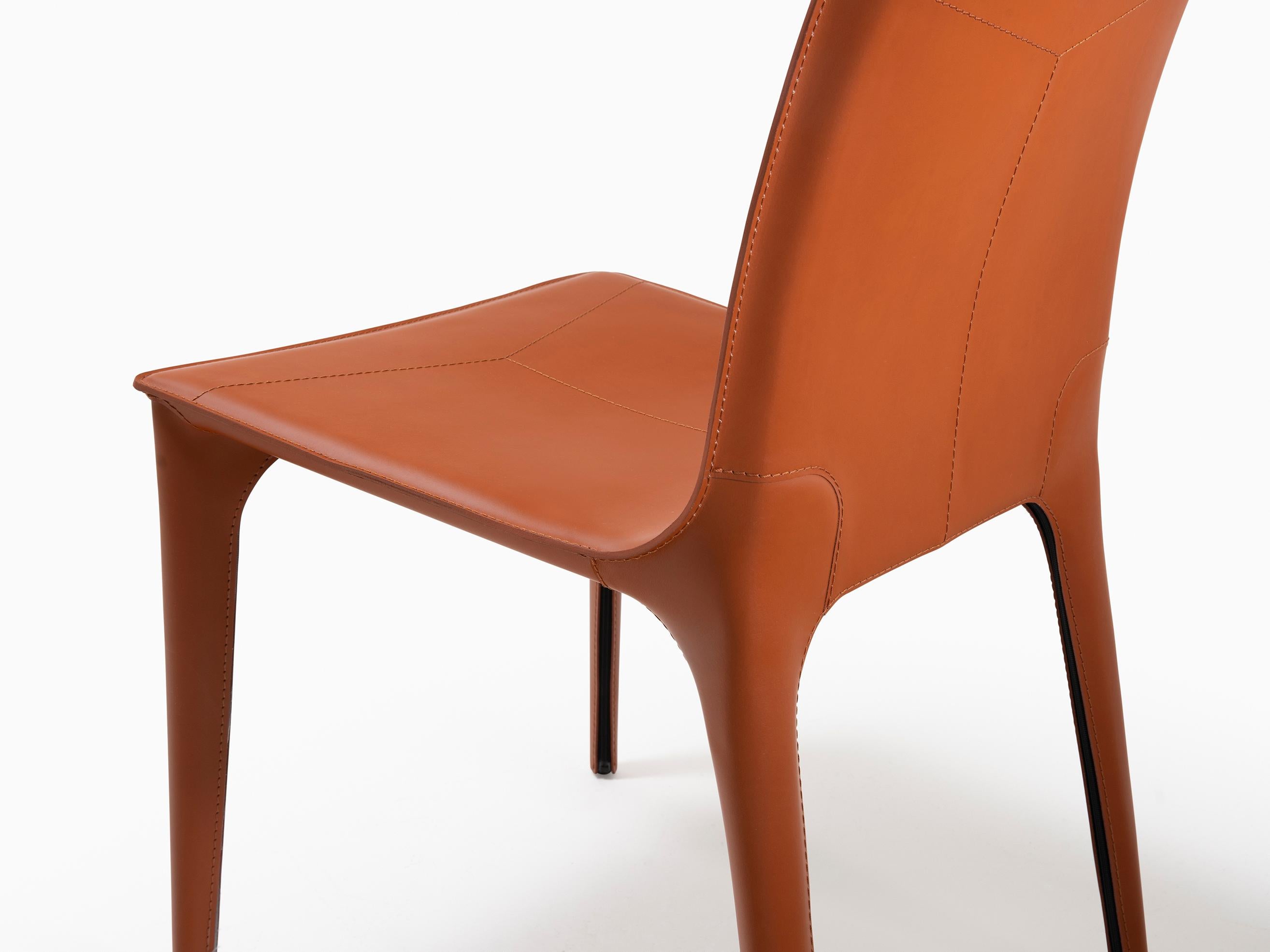 HOLLY HUNT Adriatic dining side chair in sierra leather. This simple and elegant dining chair is covered in Italian saddle Leather. From the slightly curved back and slender legs, the lines of this chair flow one into the next for a seamless, modern