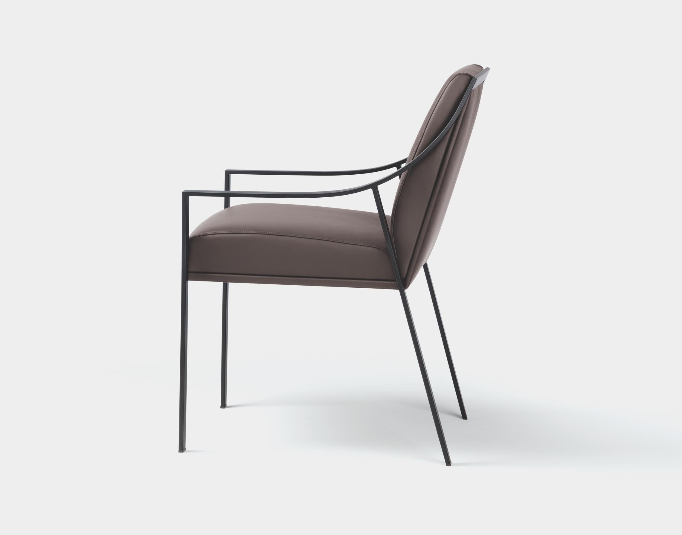Holly Hunt Aileron black dining arm chair with leather seat by Christophe Pillet

Additional Information:
Material: Metal, upholstery
Frame: Metal
Frame finish: Matte Black Lacquer
Seat & back finish: 02-610 Caffe leather
Dimensions: 21.25 W
