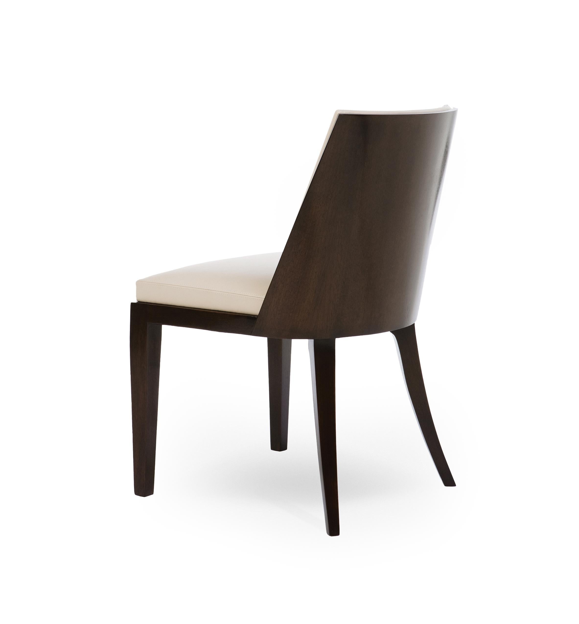 Holly Hunt Crescent dining chair in walnut cinder frame with upholstered seat

Additional Information:
Material: Walnut, upholstery
Frame: Walnut
Frame finish: Walnut Cinder
Seat & back finish: 9250/02 Milano Duomo leather
Dimensions: 20.75 W