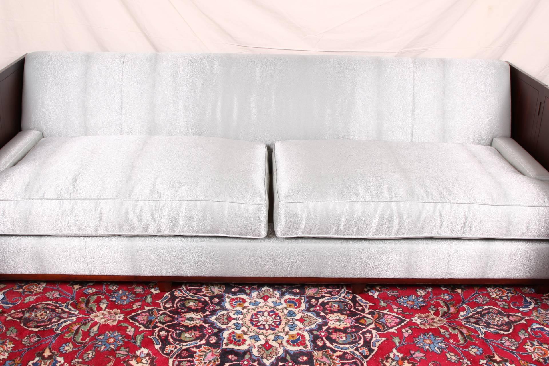 Holly Hunt design faux shark skin sofa, mahogany frame with removable tall side panels attached with brass hinges at the back., raised on four block feet across front and back, upholstered in a silver tone faux shark skin (shagreen) fabric with two