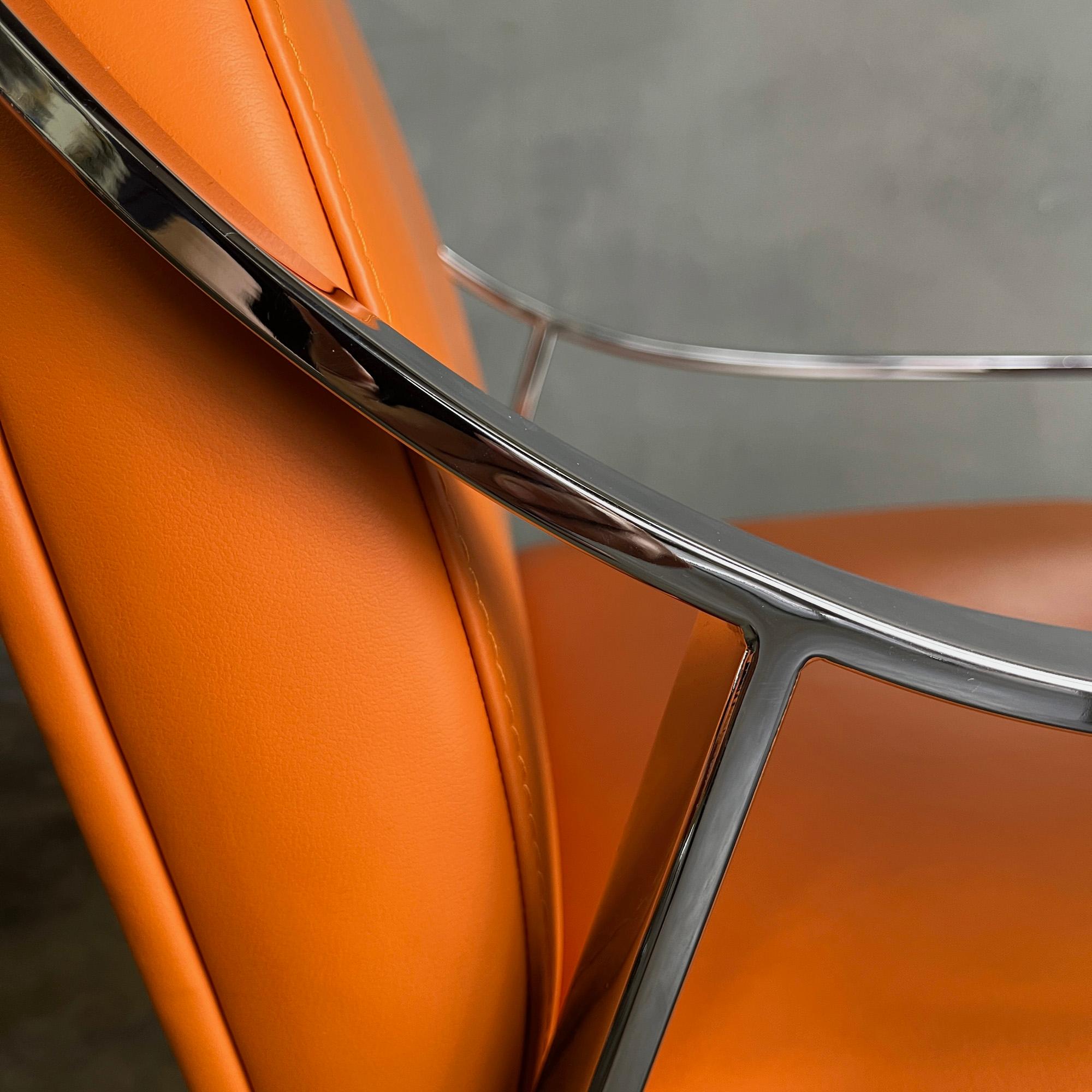 Gorgeous set of 6 Holly Hunt Aileron dining arm chairs with orange leather seats on chromed frame by French designer Christophe Pillet -1990's.
