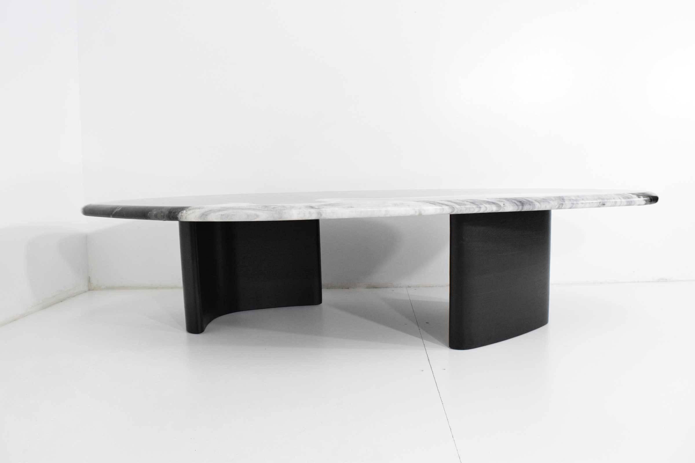Holly Hunt's Madagascar Table with Marble Top and bullnose edge. Ebonized oak base.