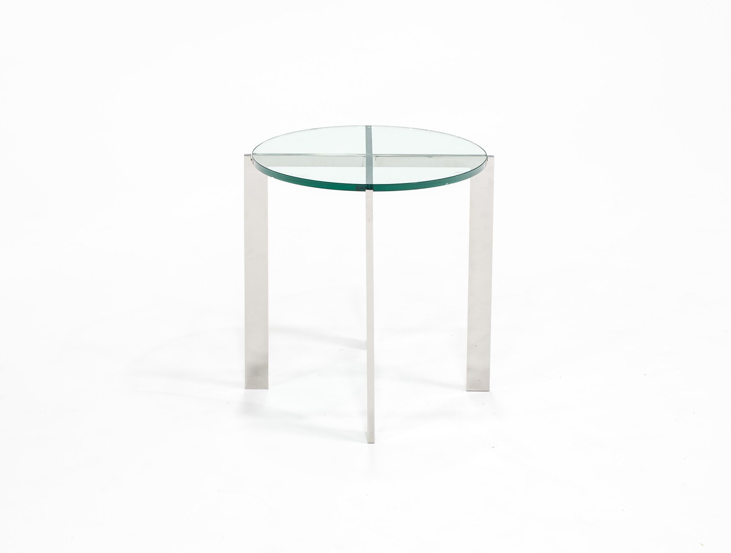 HOLLY HUNT Morgan side table in stainless steel base with glass top. Clean lines with a modern sensibility, a quiet piece that will cooperate with any style.

Additional Information:
Base: M17 Polished Stainless Steel
Top: Glass
Condition: Showroom