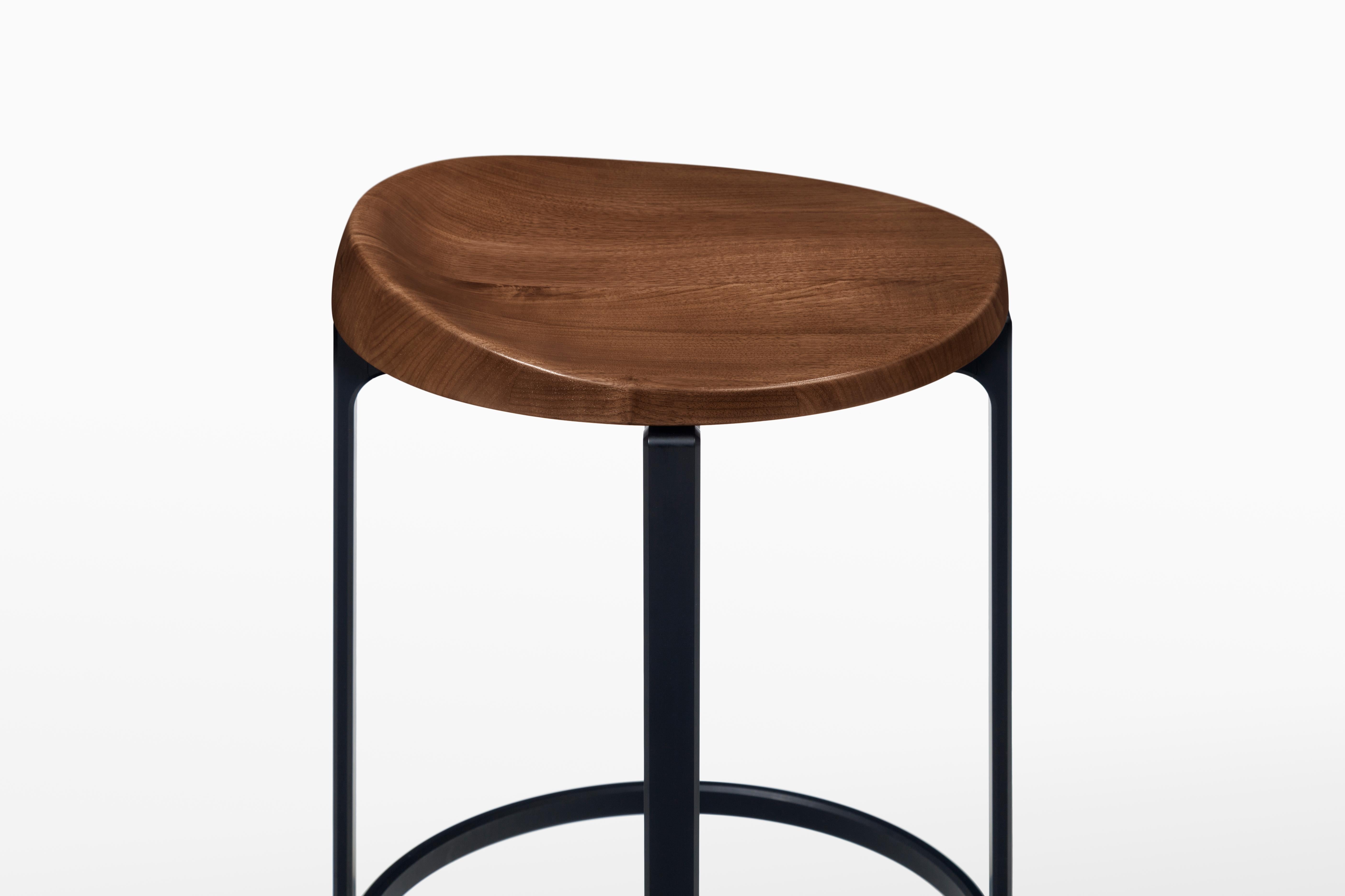 HOLLY HUNT Pepper bar stool with walnut cinder seat and aluminum frame. Unusual yet innovative, the Pepper Barstool design was inspired by the sectioned appearance of a sliced bell pepper. Advanced aluminum crafting techniques were used to construct