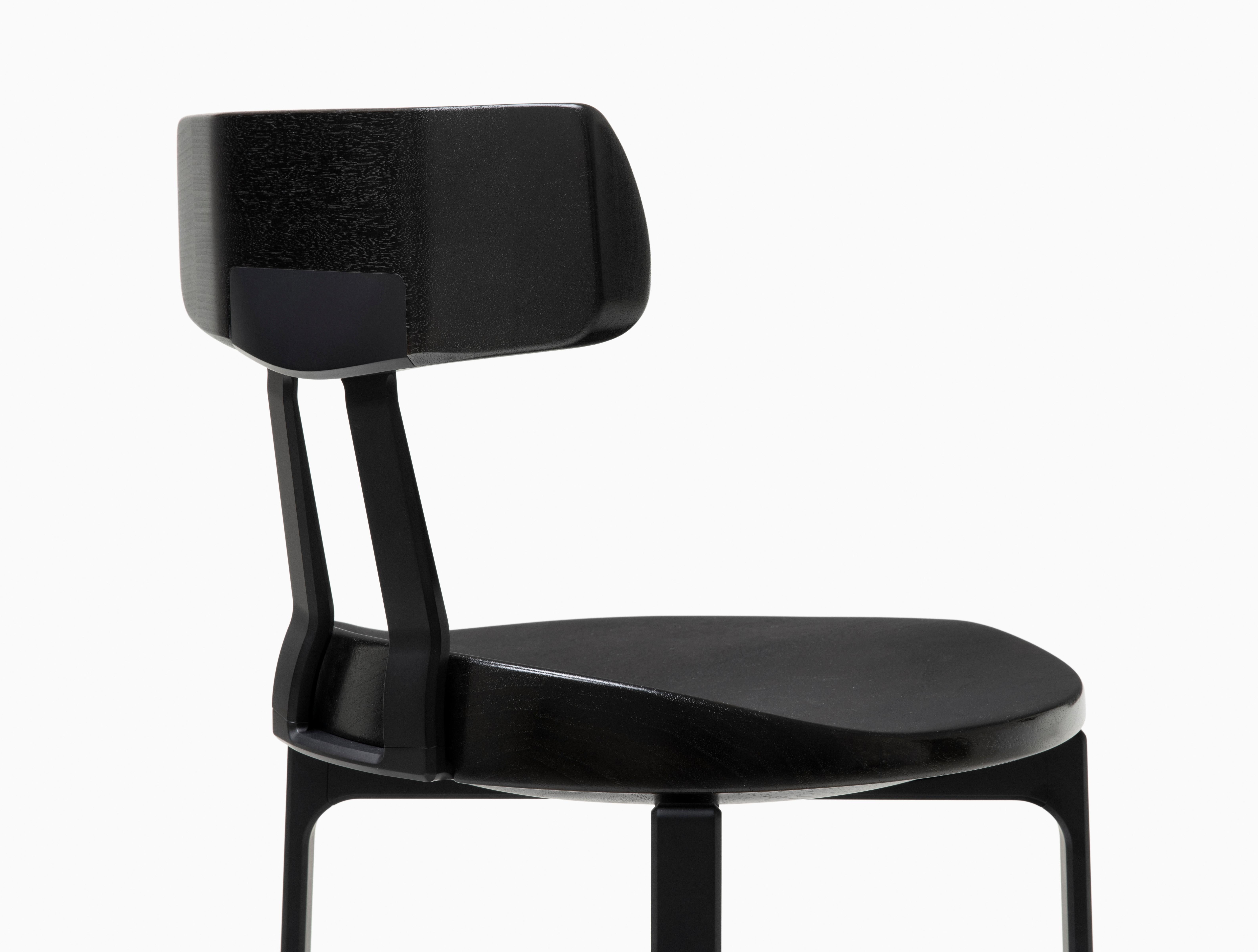 HOLLY HUNT Pepper counter stool with backrest in black walnut and aluminum frame. Unusual yet innovative, the Pepper Counter stool design was inspired by the sectioned appearance of a sliced bell pepper. Advanced aluminum crafting techniques were