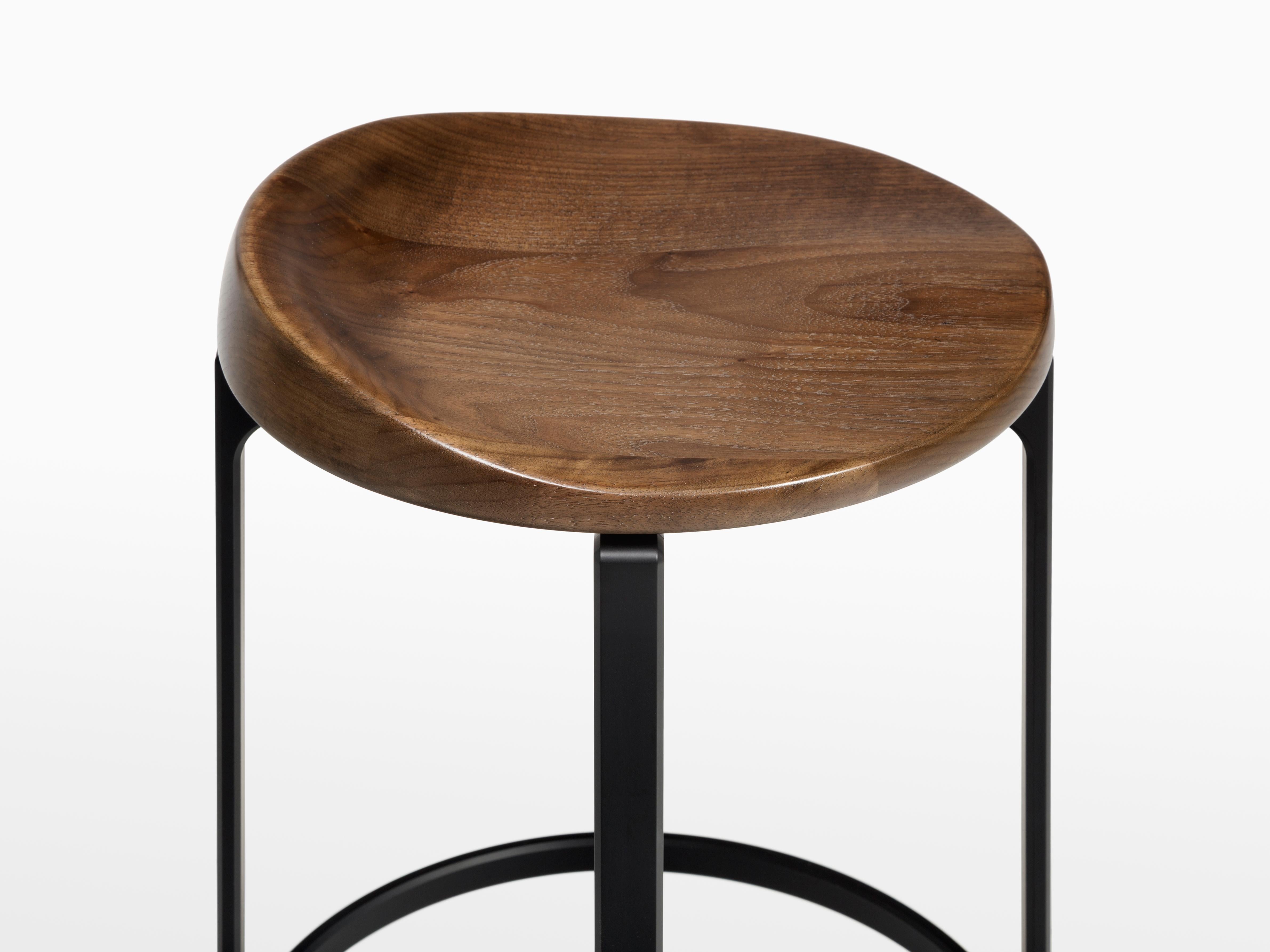 HOLLY HUNT Pepper counter stool with walnut cinder seat and aluminum frame. Unusual yet innovative, the Pepper Counter stool design was inspired by the sectioned appearance of a sliced bell pepper. Advanced aluminum crafting techniques were used to