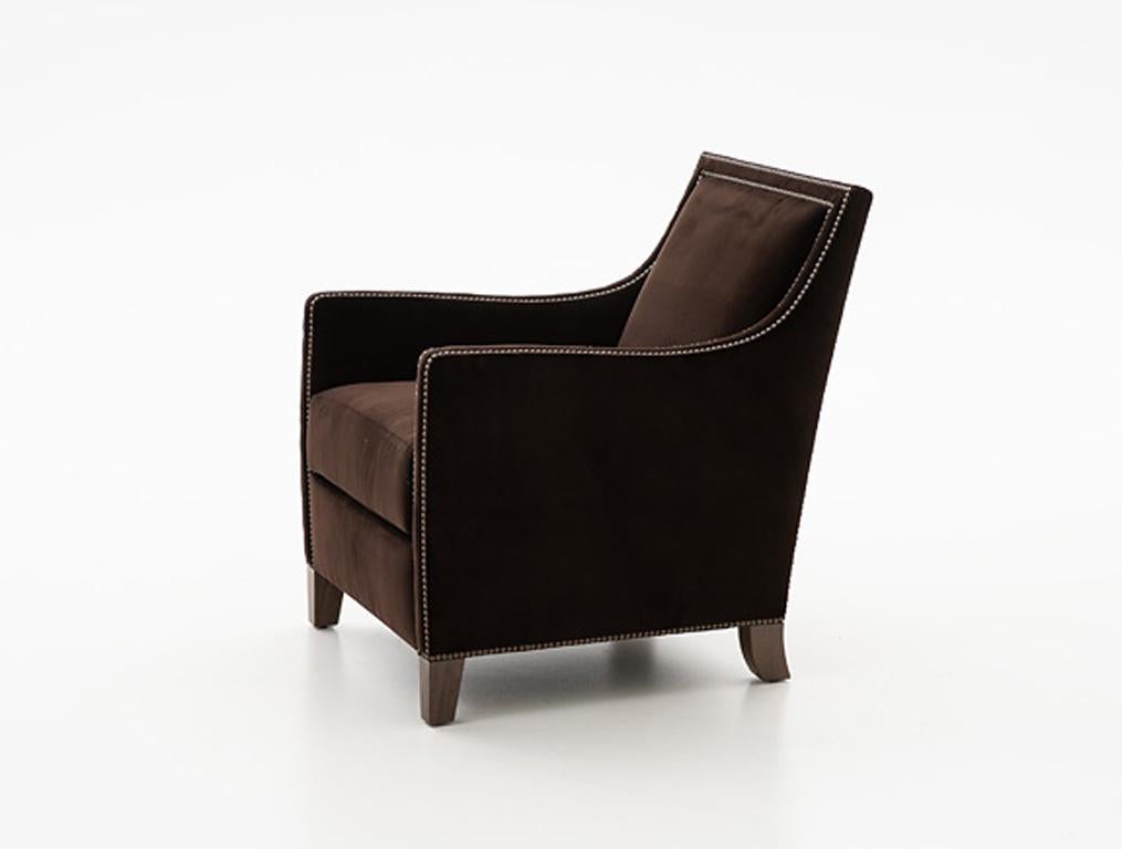 Holly Hunt Percheron chair with walnut legs and brown upholstery

Additional Information:
Materials: Walnut, upholstery with nail head
Frame finish: Walnut espresso
COL: Sevilla / Costa Brava
Nail head: Pewter
Dimensions: 27 W x 31 D x 33.75 H
Arm