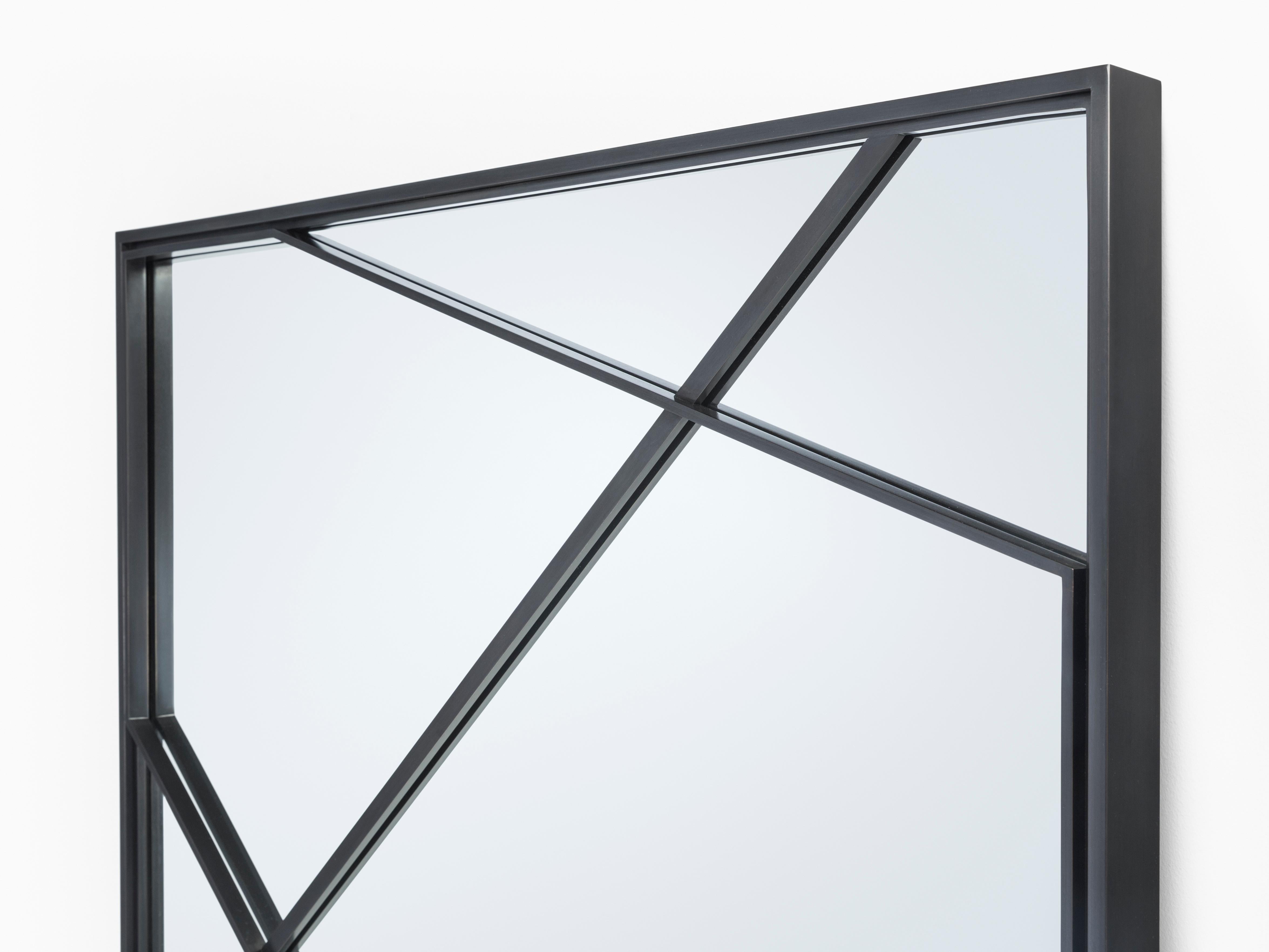 Displaying exquisite metalwork, this perspective-shifting design brings gridded three-dimensionality to a mirror. An integration of mirror and frame, this HOLLY HUNT original is anything but expected.

Additional Information:
Material: Metal
Finish: