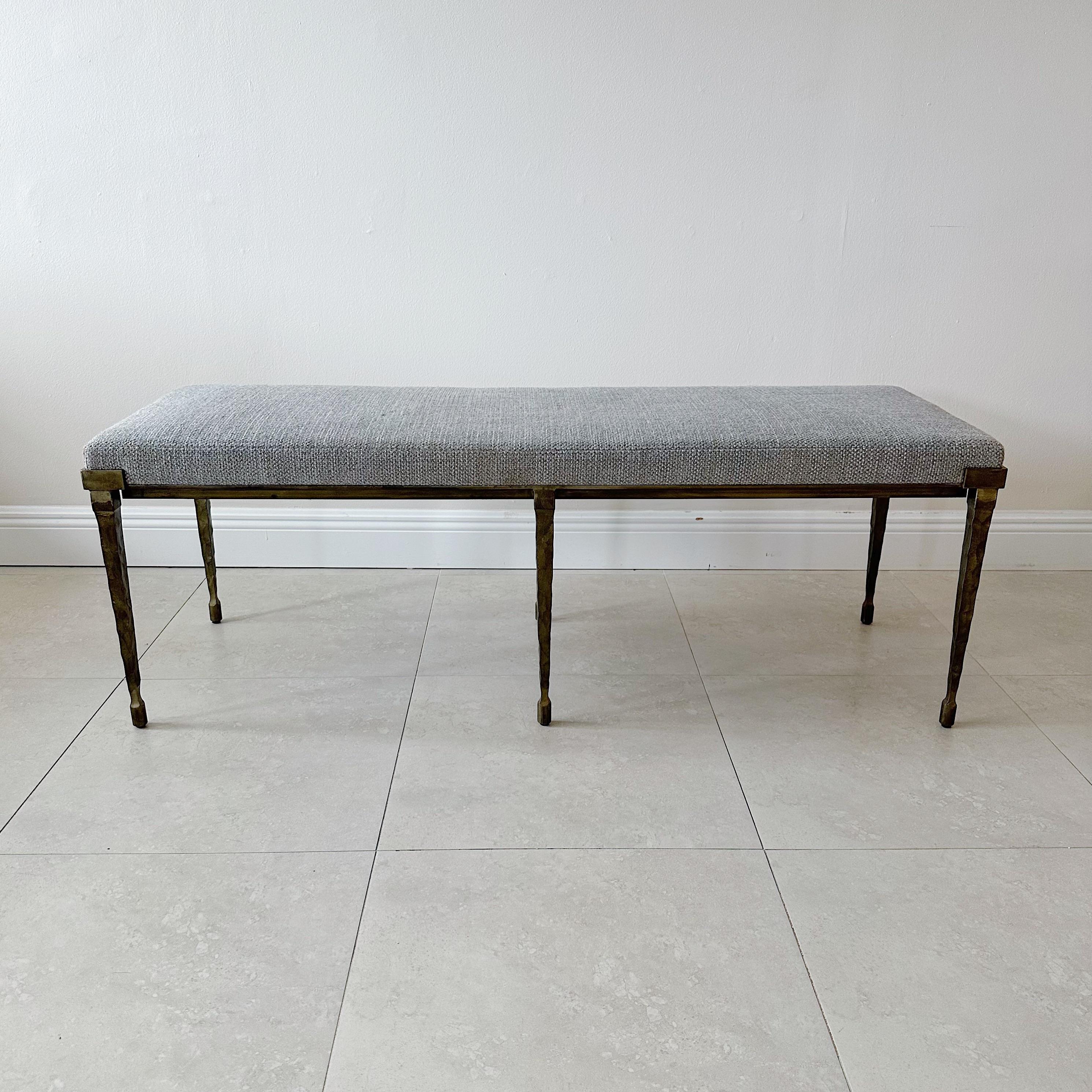 The Holly Hunt, Rue de Seine by bench takes inspiration from French mid-century neoclassicism, reimagining old-world elegance with bold, clean lines. The hand-forged iron base has a textured bronze finish that adds to its visual appeal. The bench is