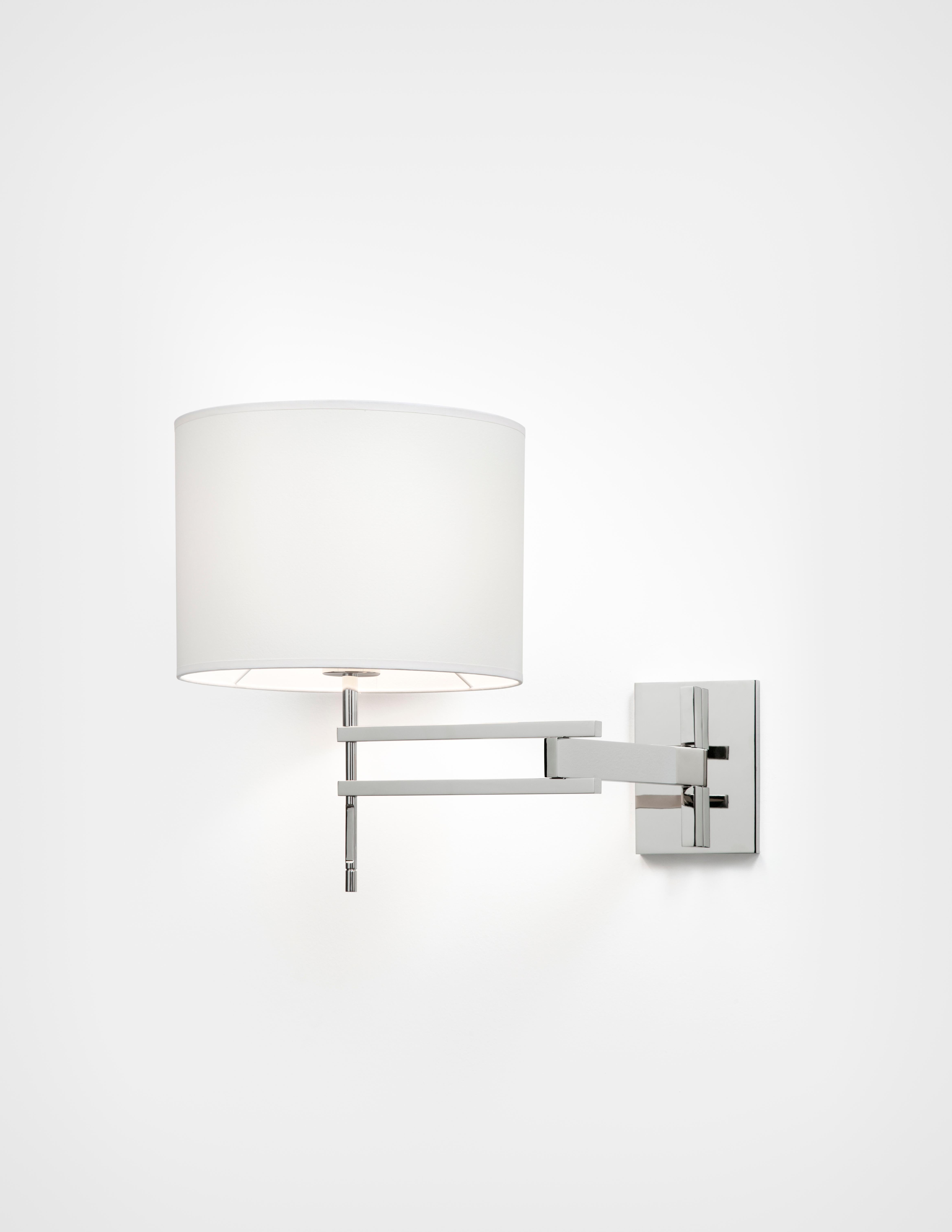 HOLLY HUNT Signature Swing Arm sconce in polished nickel with aquarelle shade. An articulating sconce ideal for bedside or reading use. Simple, distilled modern design that is practical, functional, and serene.


Additional Information:
Structure: