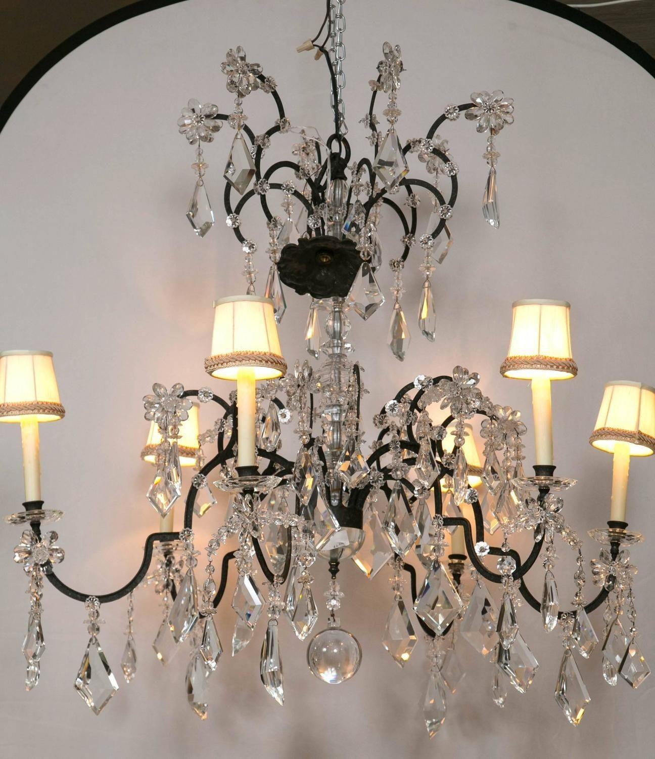 A Holly Hunt Wrought Iron and Crystal Chandelier.
 
From a spectacular home on the North Shore of Long Island comes this fine Holly Hunt wrought iron and crystal chandelier. This iconic designers style and flair are shown at every angle of this