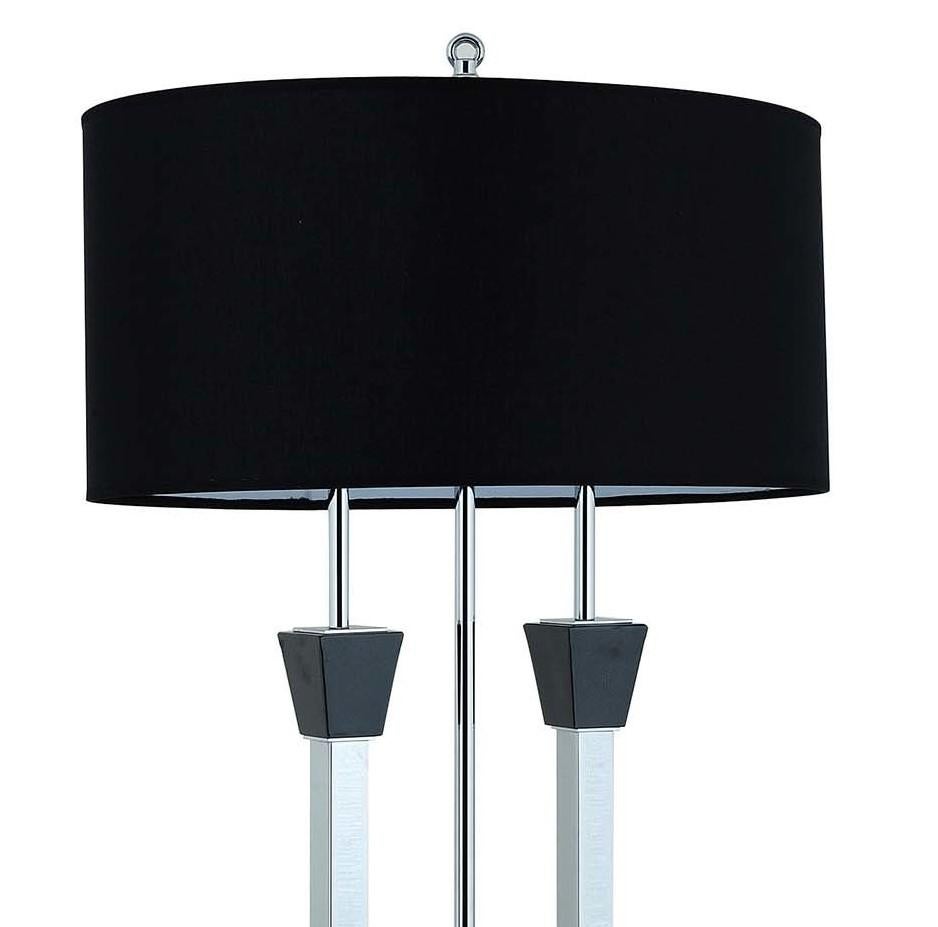 Fusing fashion with function, this modernist table lamp will bring sleek aesthetic into any interior, diffusing an inviting light into any Minimalist or Postmodern decor. Made of chrome-finished brass, the elegant structure stands on a rectangular