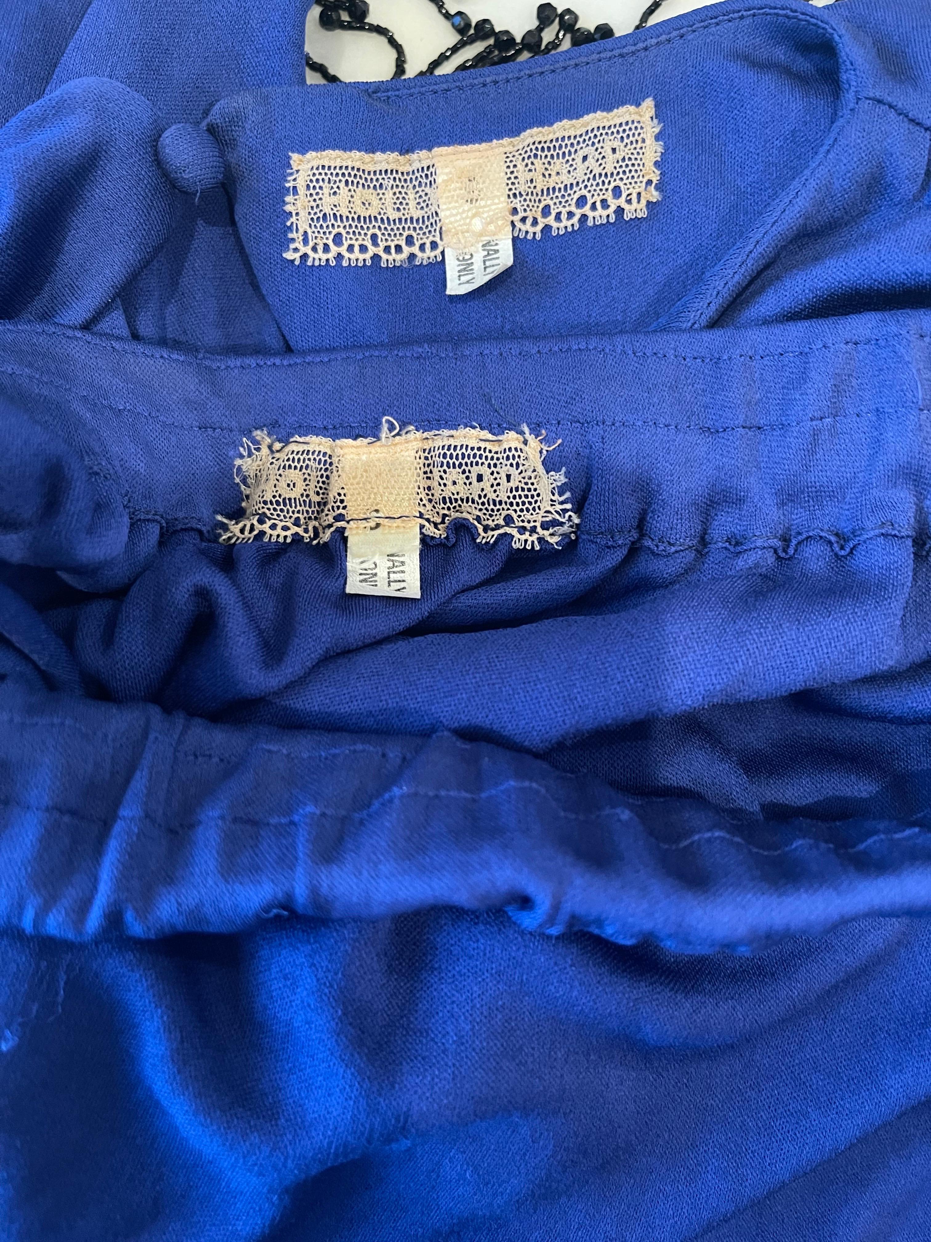Beautiful vintage Holly’s Harp late 70s (Spring 1978) royal blue silk jersey 3 piece ensemble! Crop top simply sips over the head, has a elastic waistband, and a single button closure at back neck. Full length skirt has an elastic waistband.