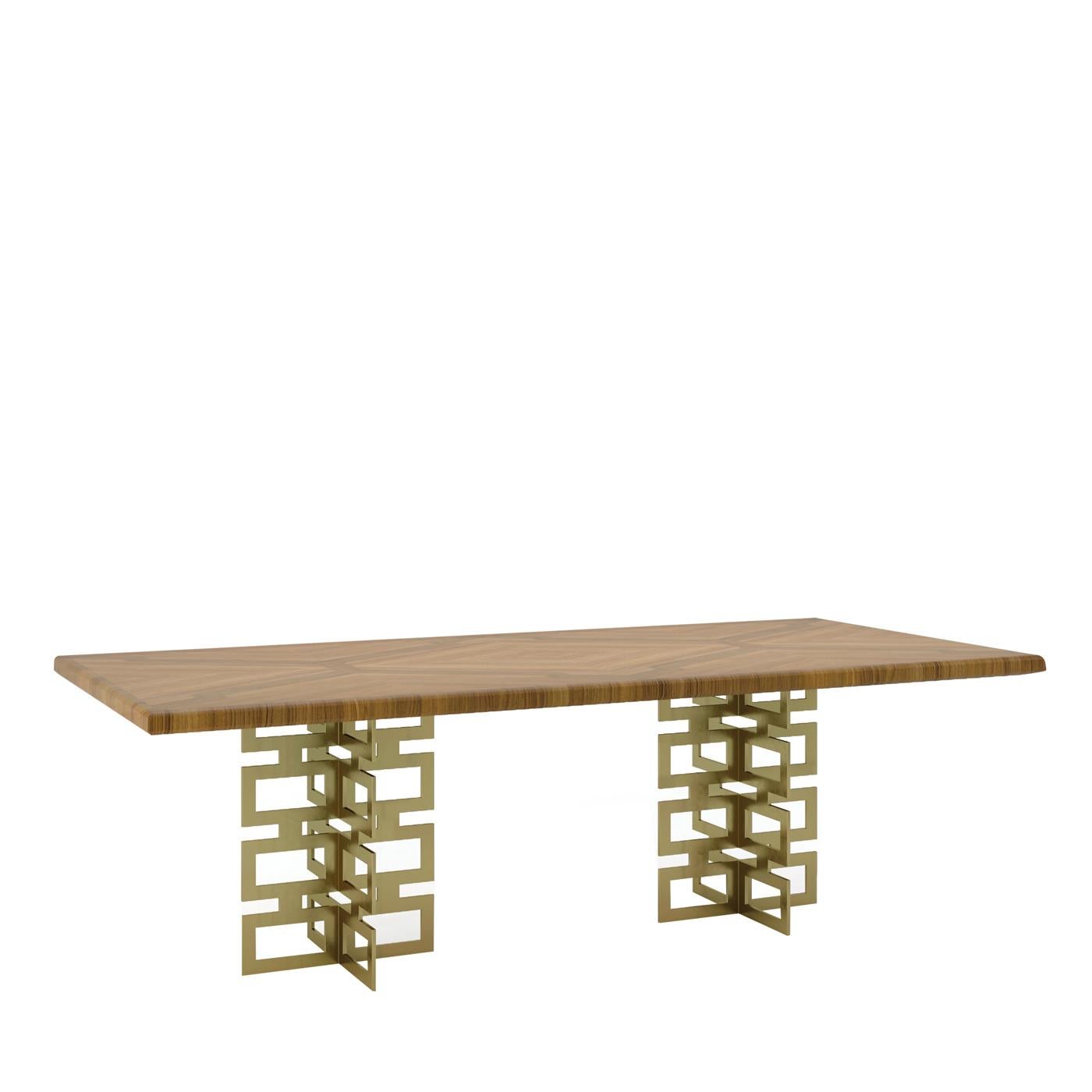 Masterfully evoking Hollywood's seductive flair, this majestic dining table displays a sturdy rectangular top in inlaid wood, which is also available in different wood finishes and lacquers or beveled glass. Two support structures made of