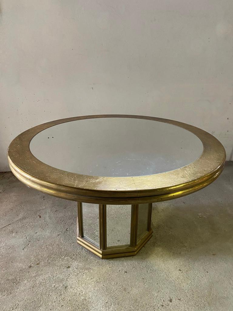 One of a kind, Gony Nava (signed), brass / copper and mirror glass dining table with octagonal base. The base has mirror surfaces framed with brass frames and a round top with mirror and brass edging. The table is in 2 parts (the top can be detached