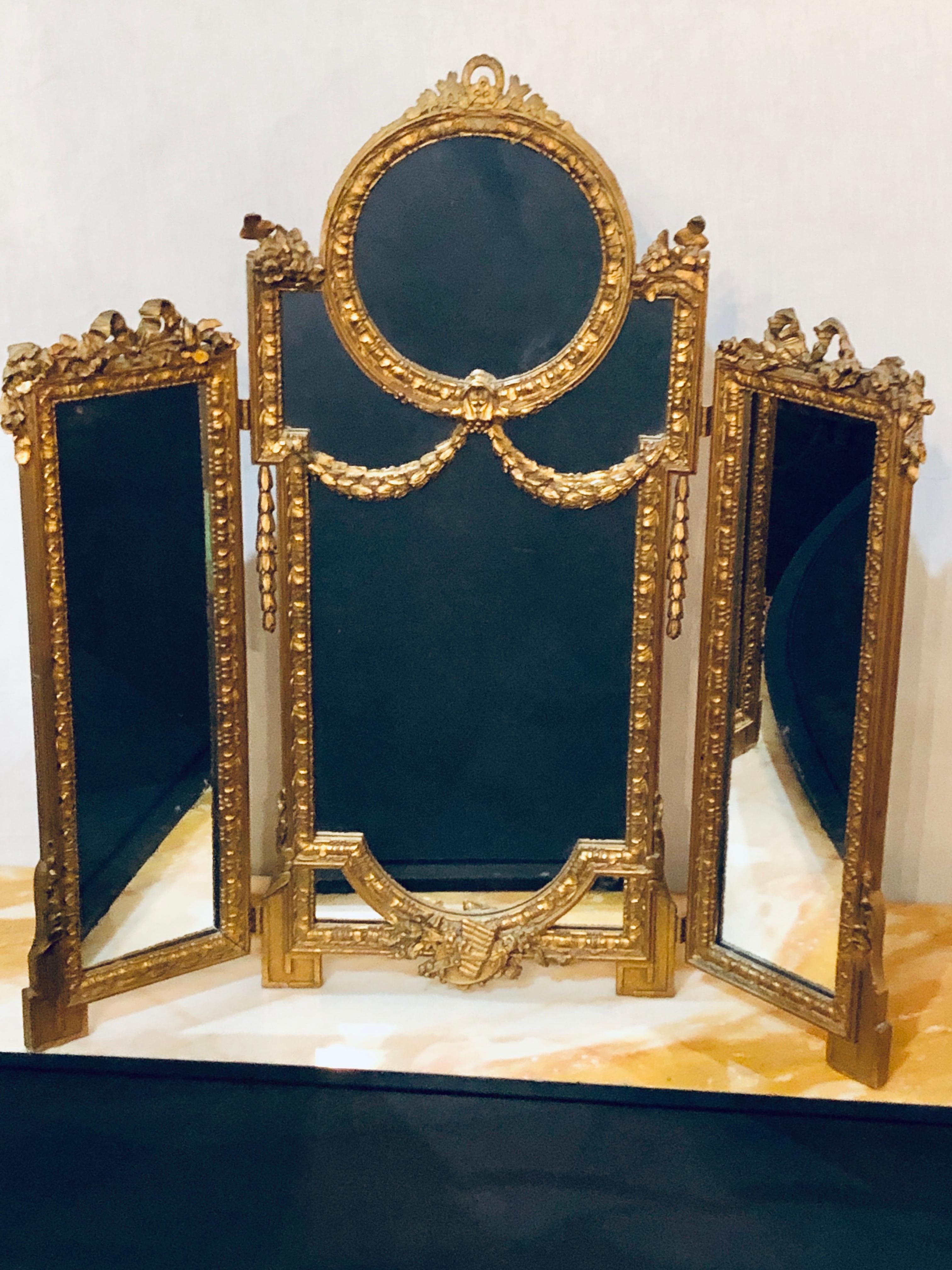 French Hollywood Regency 1940s Louis XVI Style Gilt wood Trifold Vanity or Table Mirror