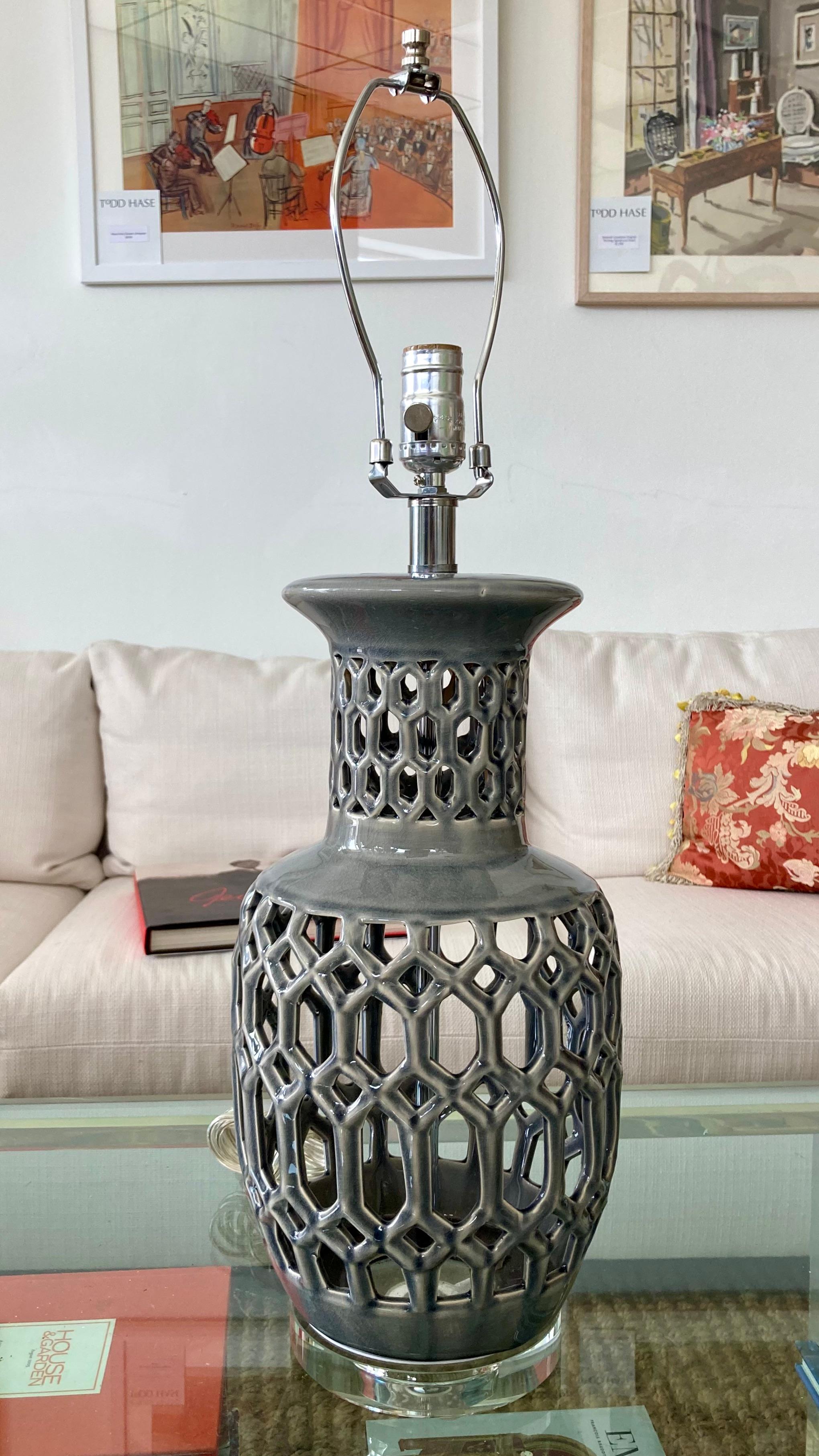 Beautiful Hollywood Regency 1970s gray glazed lattice ceramic table lamp with lucite base. Great addition to your modern interiors and table tops. Just add a shade of your choice.