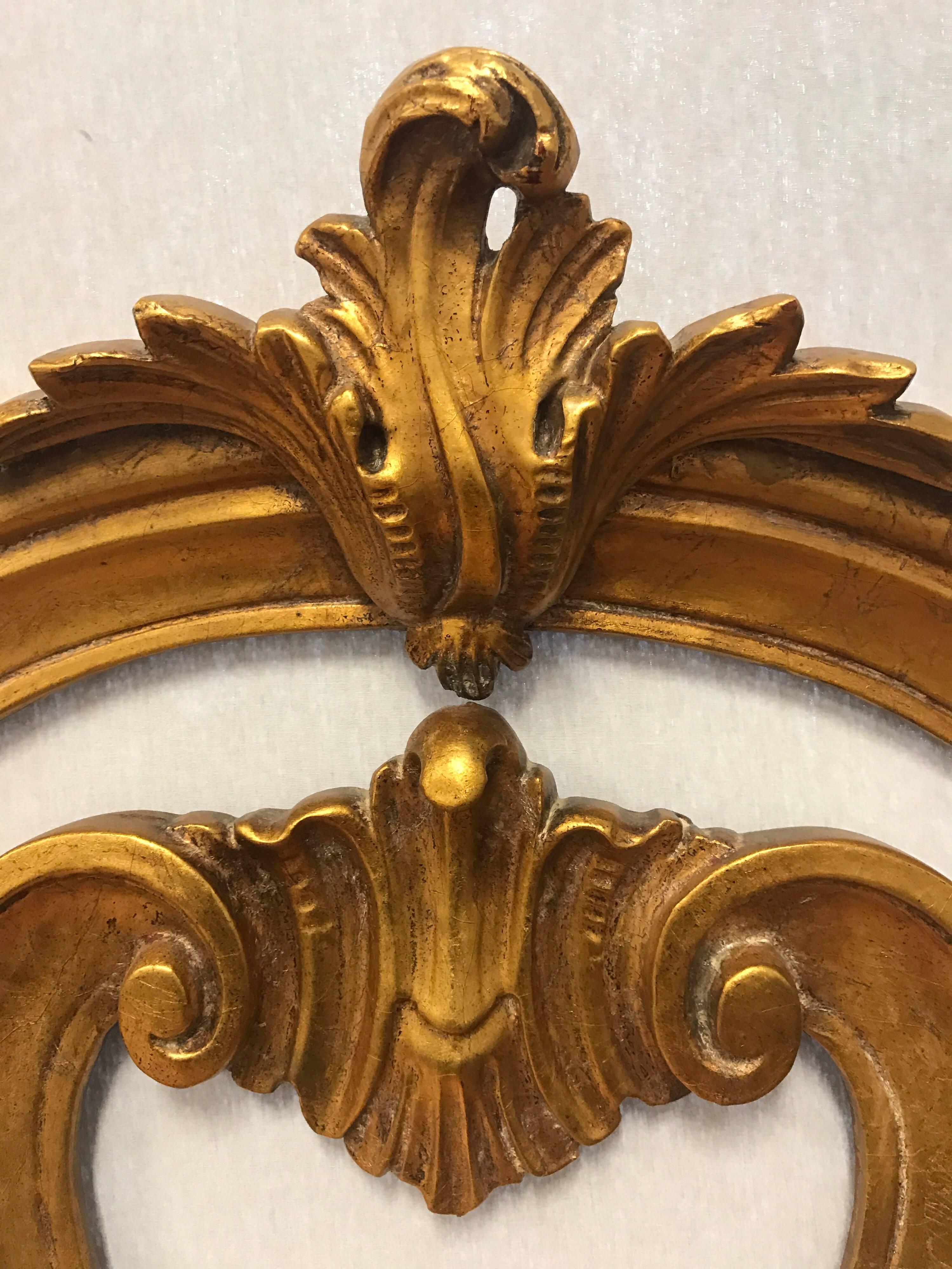 Hand-carved throughout and adorned with giltwood throughout. Guaranteed to make a statement!