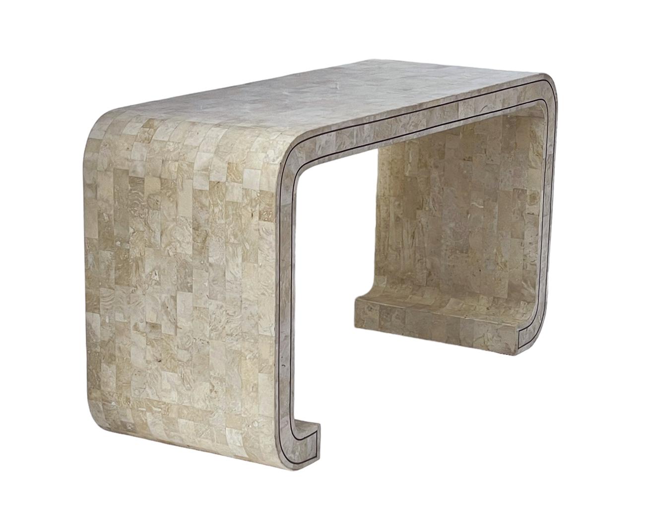 Gorgeous waterfall console in tessellated stone and probably made by maitland smith. Beautiful polished beige marble with inlayed brass trim. Very good ready to use condition. 