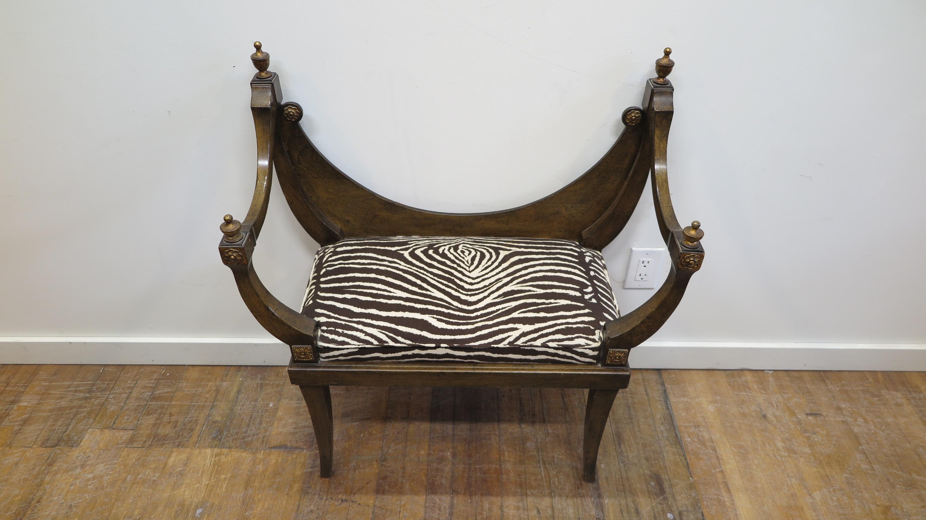 Midcentury Hollywood Regency bench seat. Throne style bench with suede Zebra fabric. Gilt carved details of florets with urn topped arms. Seat height 18.5 inches, seat opening is 21.5, seat width in middle is 24 inches. Upholstery is recent. Very