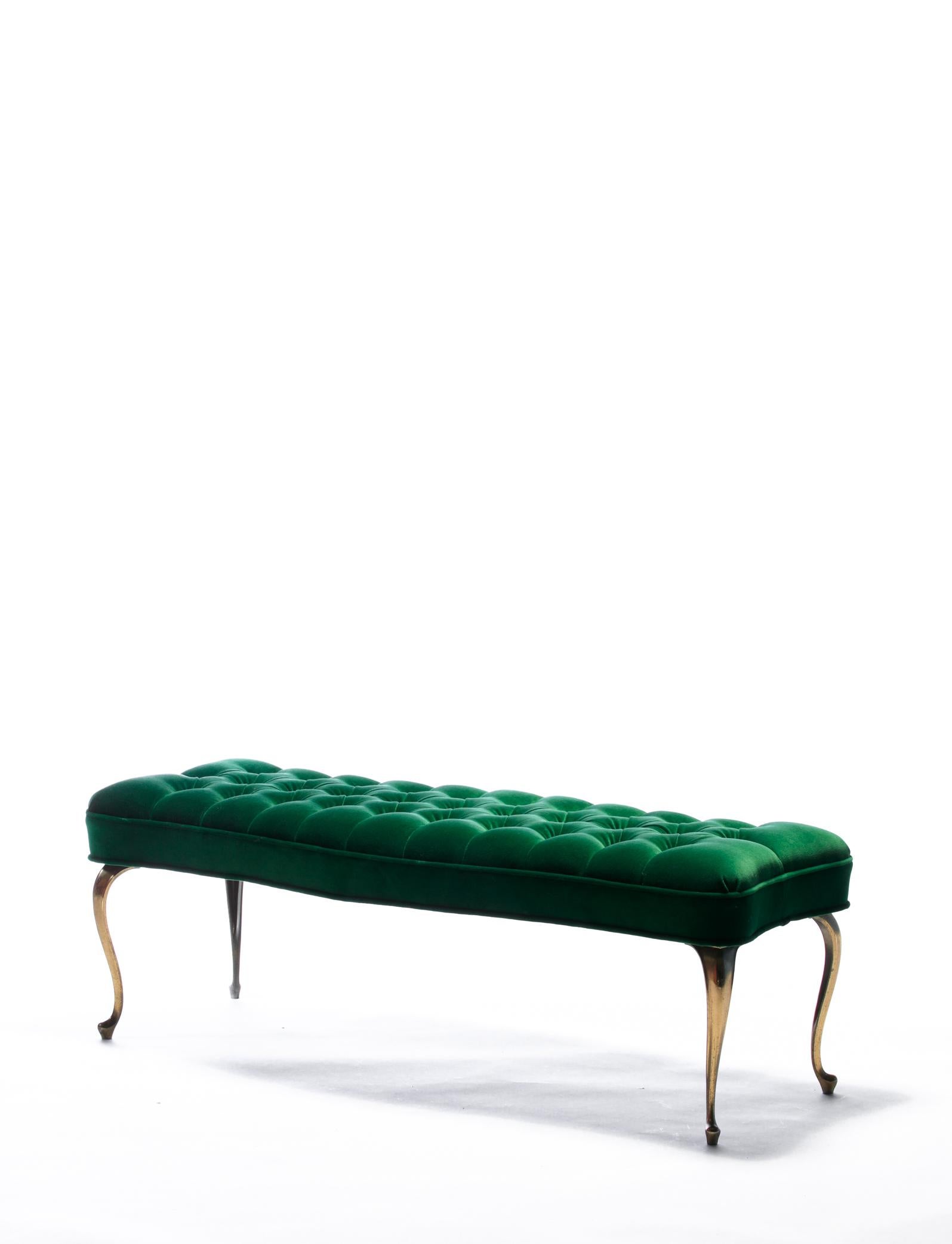 Vintage tufted seat beach with sexy splayed brass legs, newly upholstered in emerald green velvet upholstery. An elegant and stylish bench in the glamorous Hollywood Regency style. This bench would be well suited for a fabulous foyer or at the end