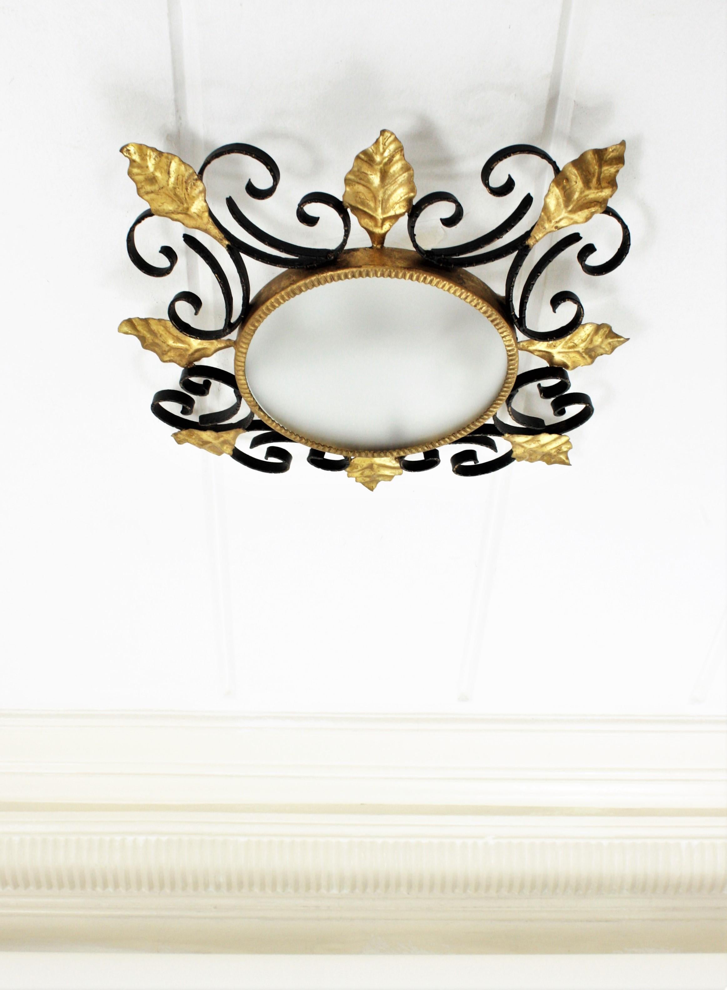 Hollywood Regency Scroll Foliate Black and Gilt Wrought Iron Flush Mount or Wall Mirror