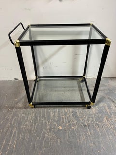 Hollywood Regency Black and Gold-Tone Two-Tier Glass Bar Cart or Tea Cart