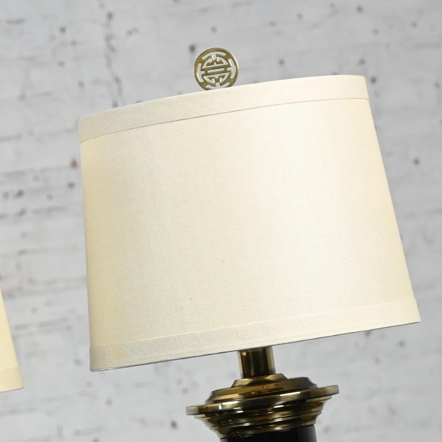 Unknown Hollywood Regency Black & Brass Plated Column Table Lamps Asian Finials a Pair For Sale