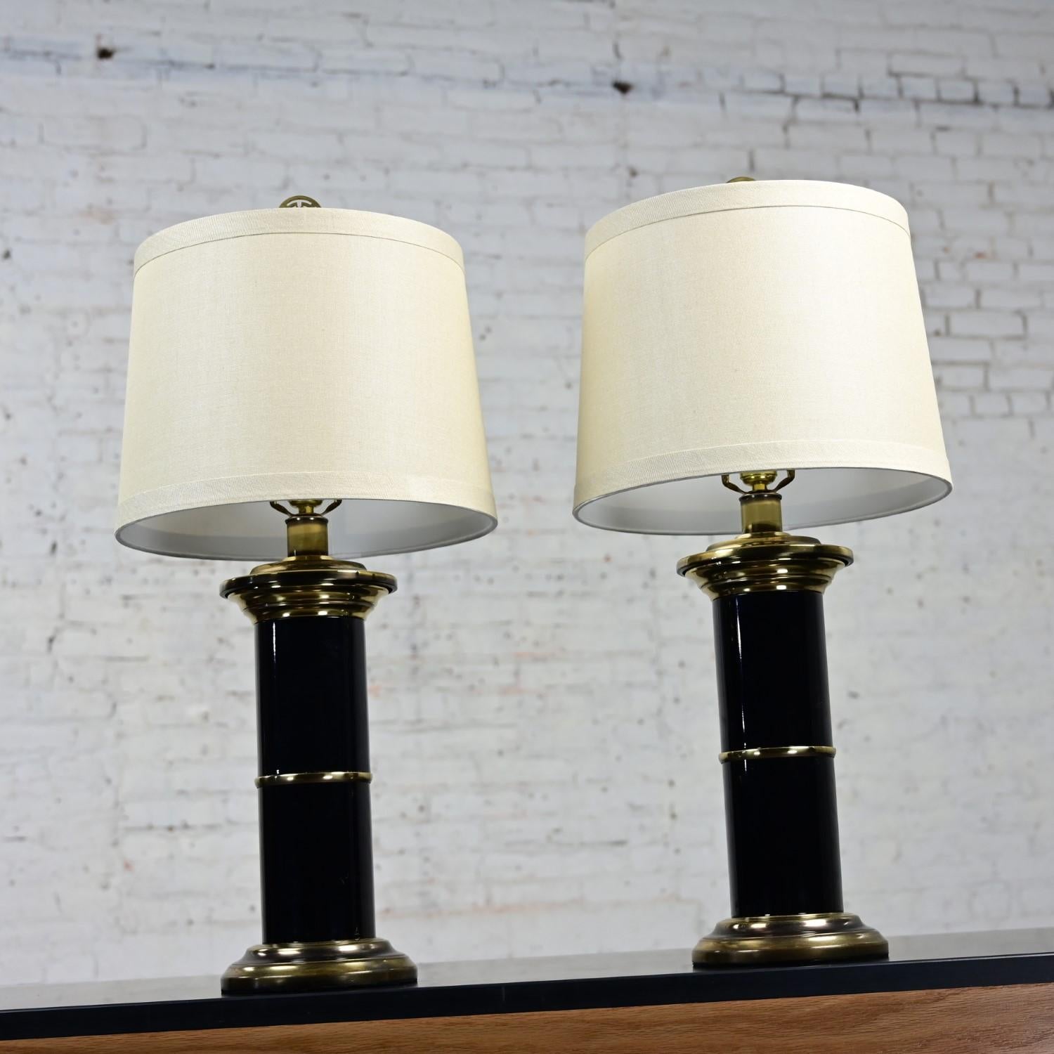 20th Century Hollywood Regency Black & Brass Plated Column Table Lamps Asian Finials a Pair For Sale