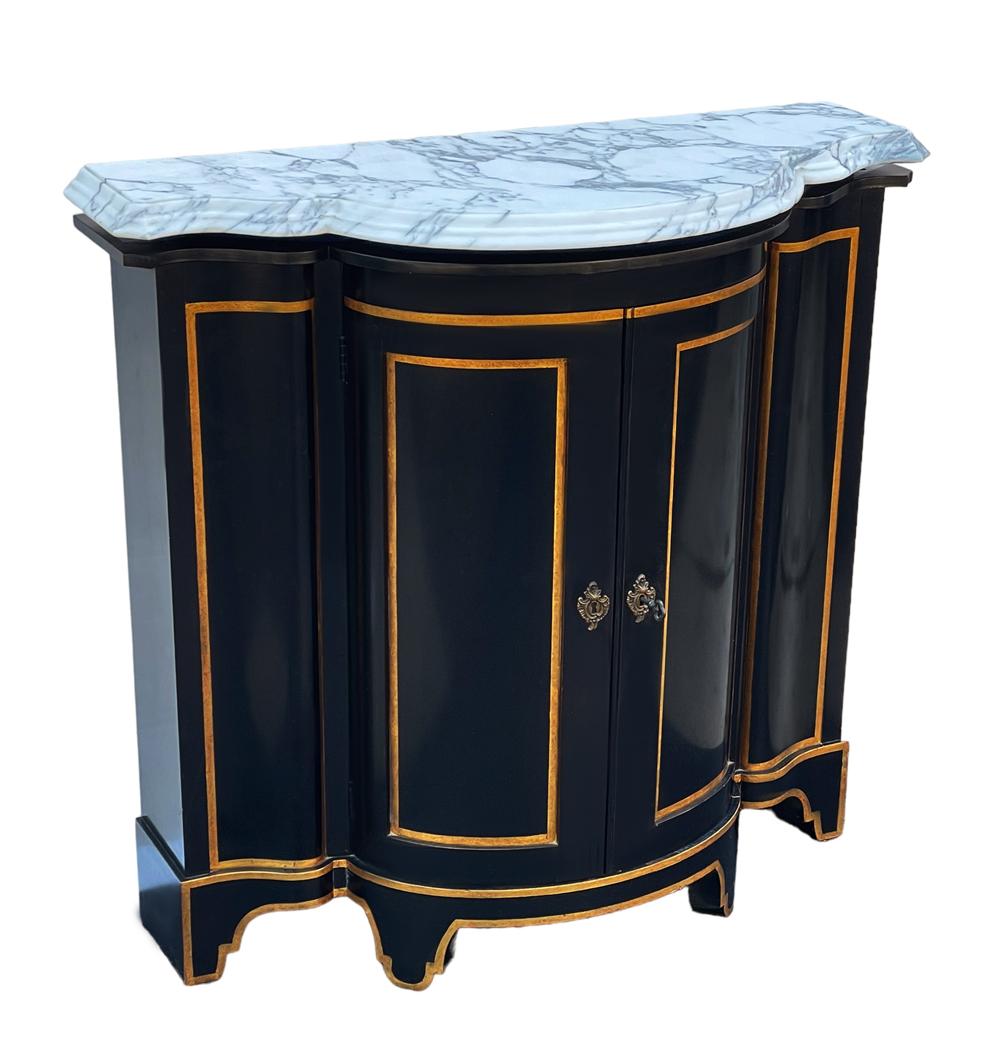 Gorgeous vintage cabinet circa 1950's by Baker Furniture. It features a beautiful black finish with gold trim and calacatta italian marble. Locking mechanism works and the key is present. Very good condition. 