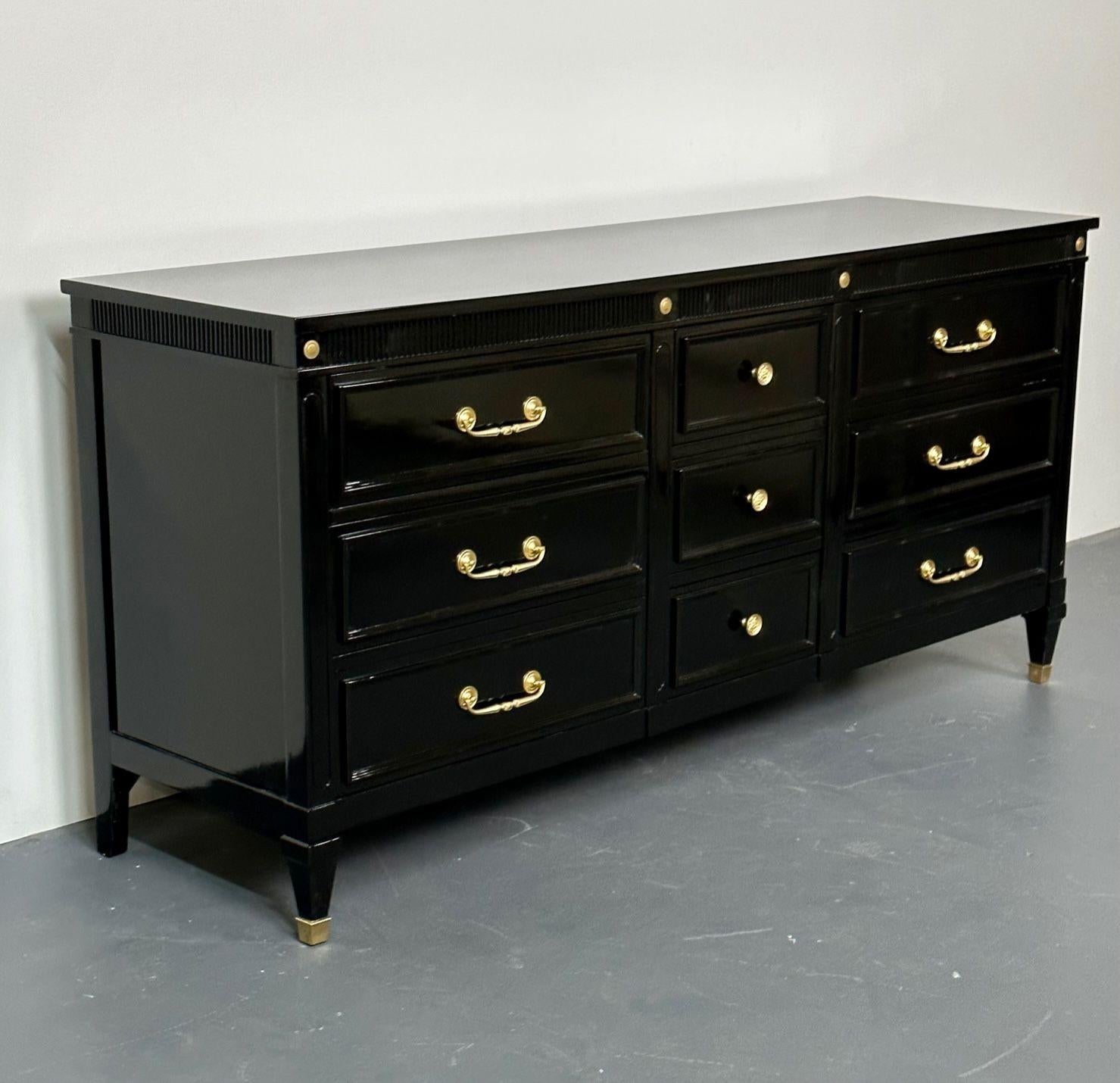 Hollywood Regency Black Lacquer Dresser, Chest, Sideboard, Maison Jansen Style
Recently lacquered in a fine Steinway Piano finish, this rich ebony dresser or commode has three center drawers flanked by three side drawers, all of which feature