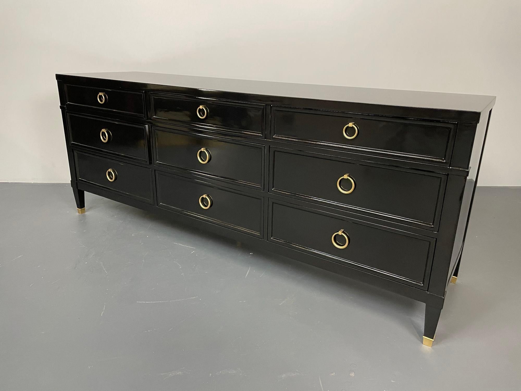 Regency Style Ebony Lacquered Chest, Dresser or Sideboard by Baker. 
A stunning, recently lacquered dresser by Baker for Milling Road. This nine drawer chest has bronze circular pulls on all drawers and is supported by tapering legs on bronze