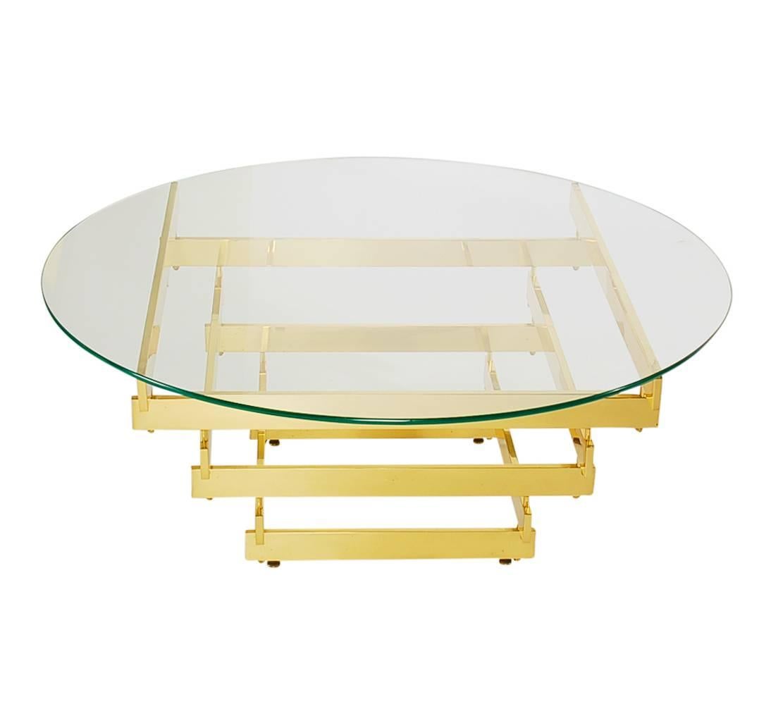 A great 1970s design by Paul Mayen for Habitat. It features a stacked brass base with thick glass top. It was very well cared for through the years and ready for immediate use.