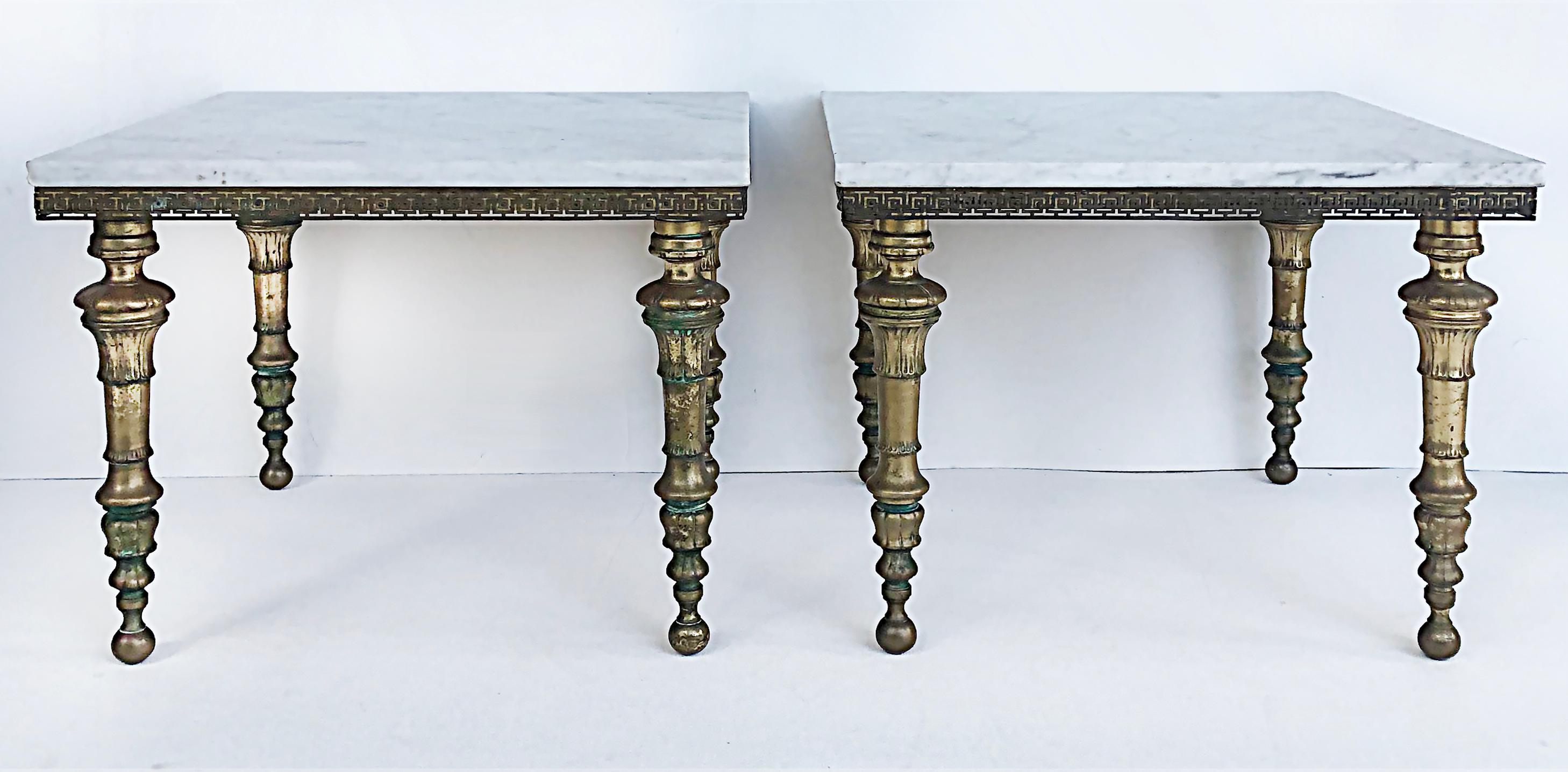 Hollywood Regency Brass and Italian Carrara Marble Tables, Pair

Offered for sale is a pair of ornate 1950s brass and white Carrera marble-topped low tables. The sides of the tables are edged with Greek Key trim and the undersides of the marble are