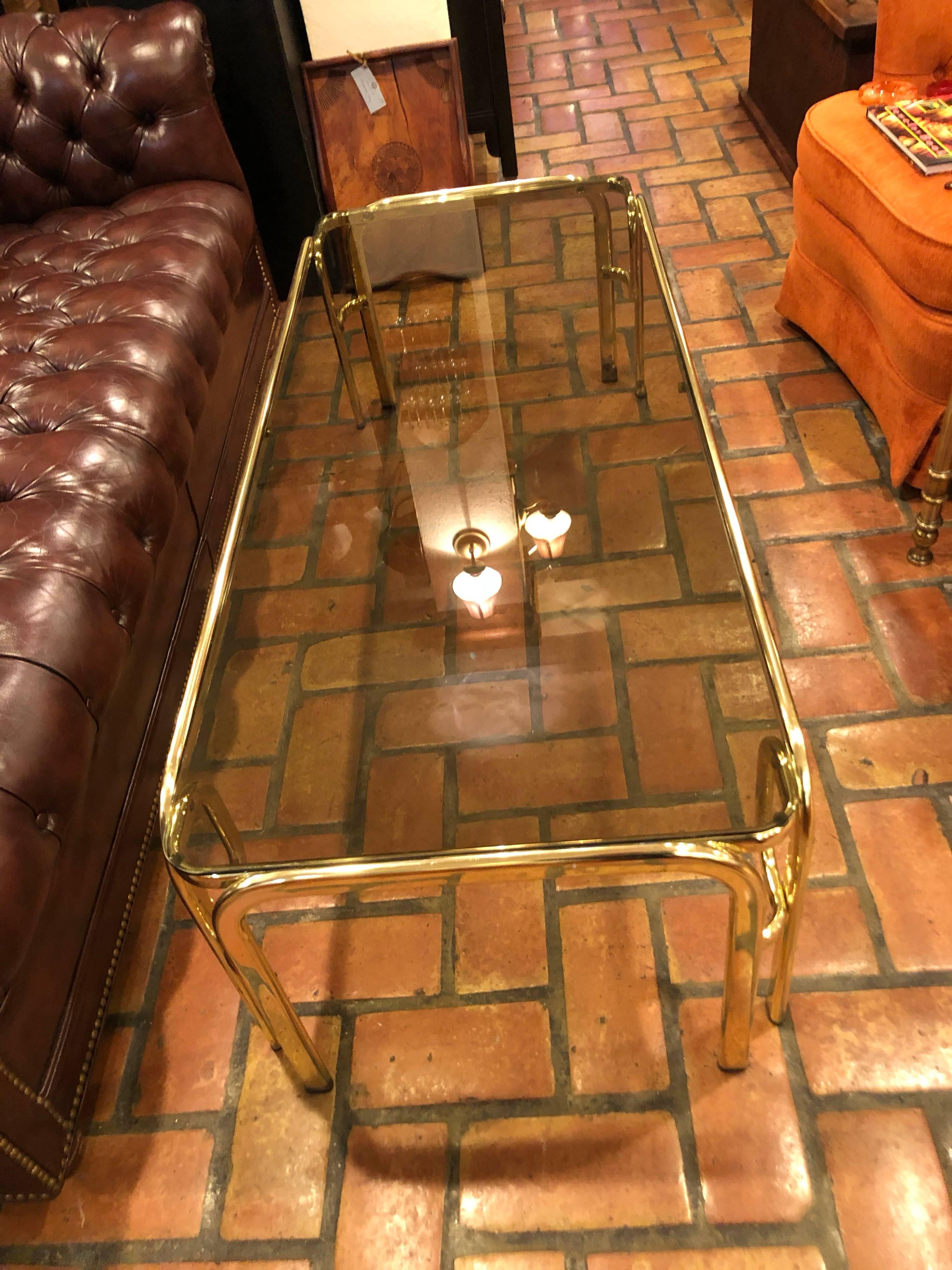 Hollywood Regency Brass and Smoked Glass Coffee Table In Fair Condition In Redding, CT
