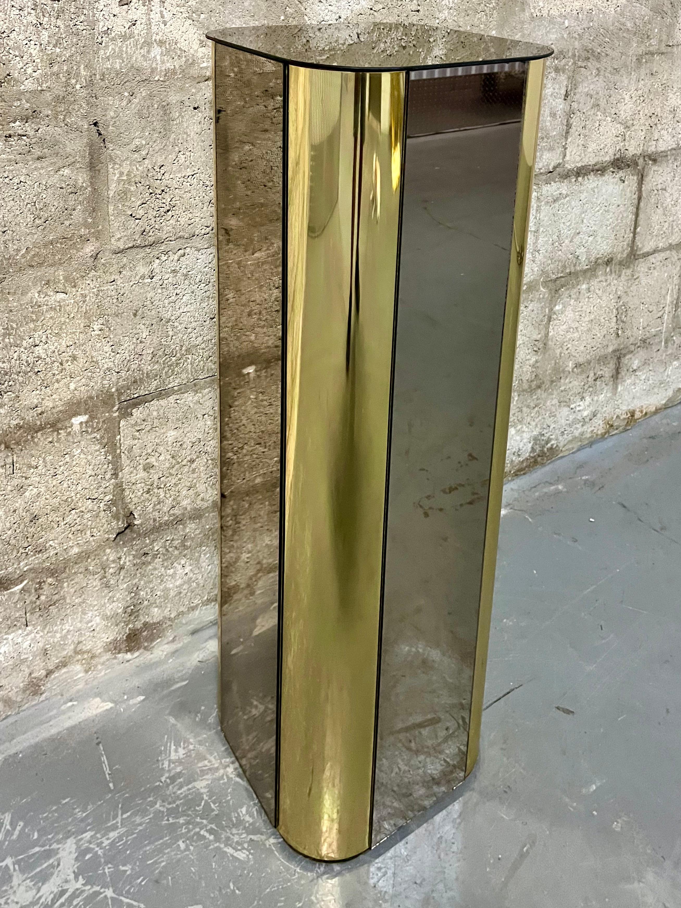 American Hollywood Regency Brass and Smoked Mirror Pedestal in the Curtis Jere's Style.