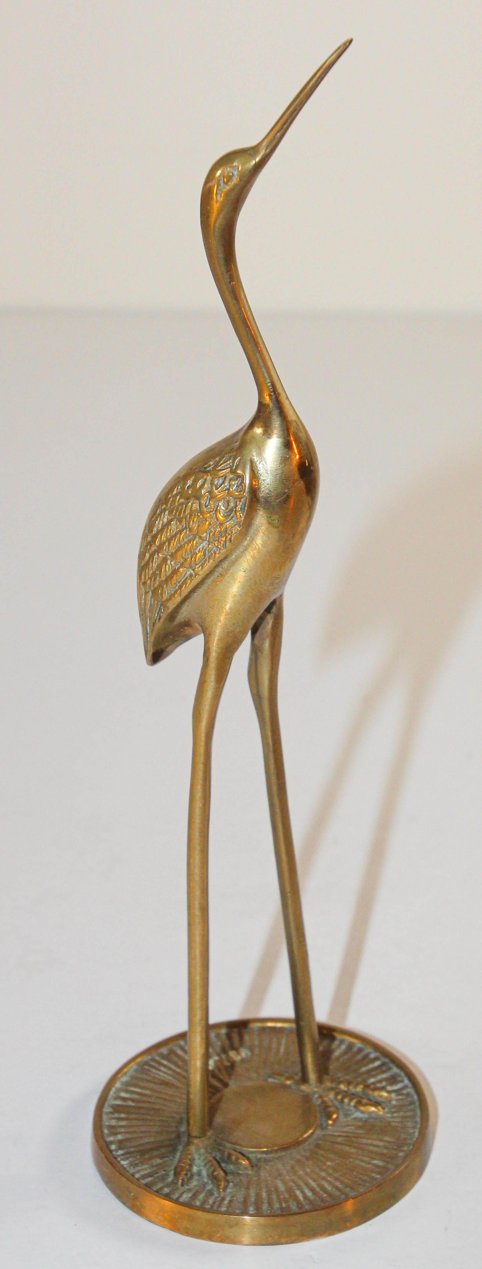 Vintage cast metal solid brass heron crane figurine.
Hollywood Regency Asian style solid polished brass heron bird sculpture.
Size : 12