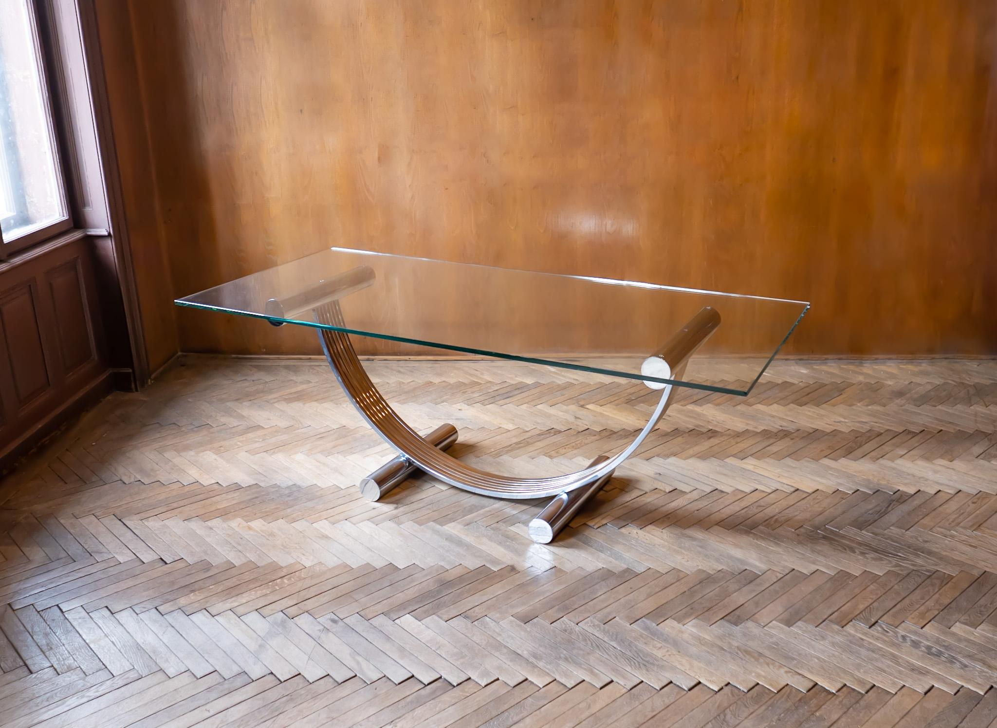 Hollywood Regency Brass Chrome Glass Dining Table by Renato Zevi for Banci Firenze, Italy 1970s.

Extraordinary dining or center table with a stunning brass and chrome base in the style of Hollywood Regency was designed by Renato Zevi and produced