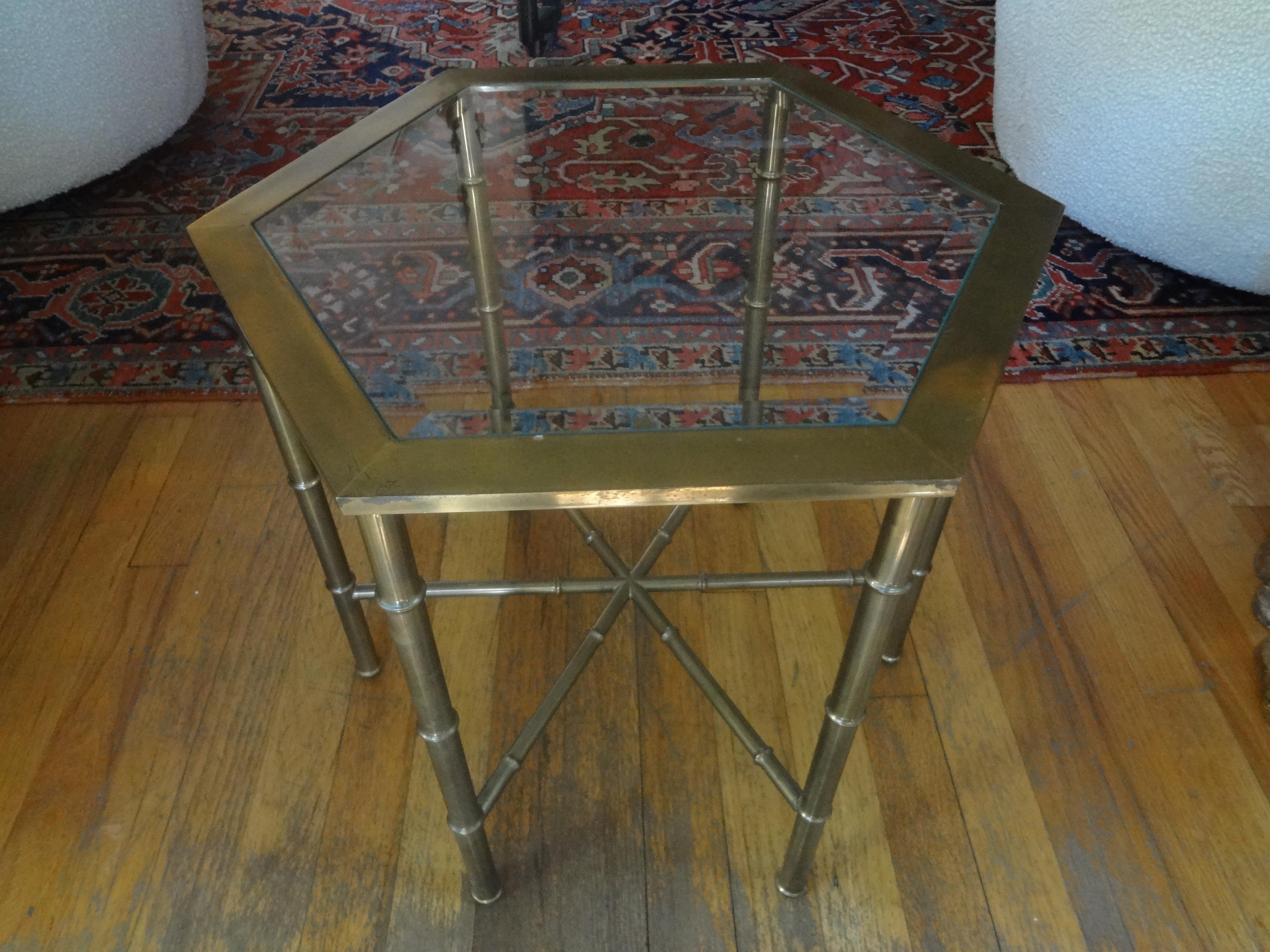 Hollywood Regency brass hexagonal table with beveled glass top. This versatile midcentury brass table can be used as a side table, drink table, end table, low table, cigarette table or gueridon. Beautiful aged patina!