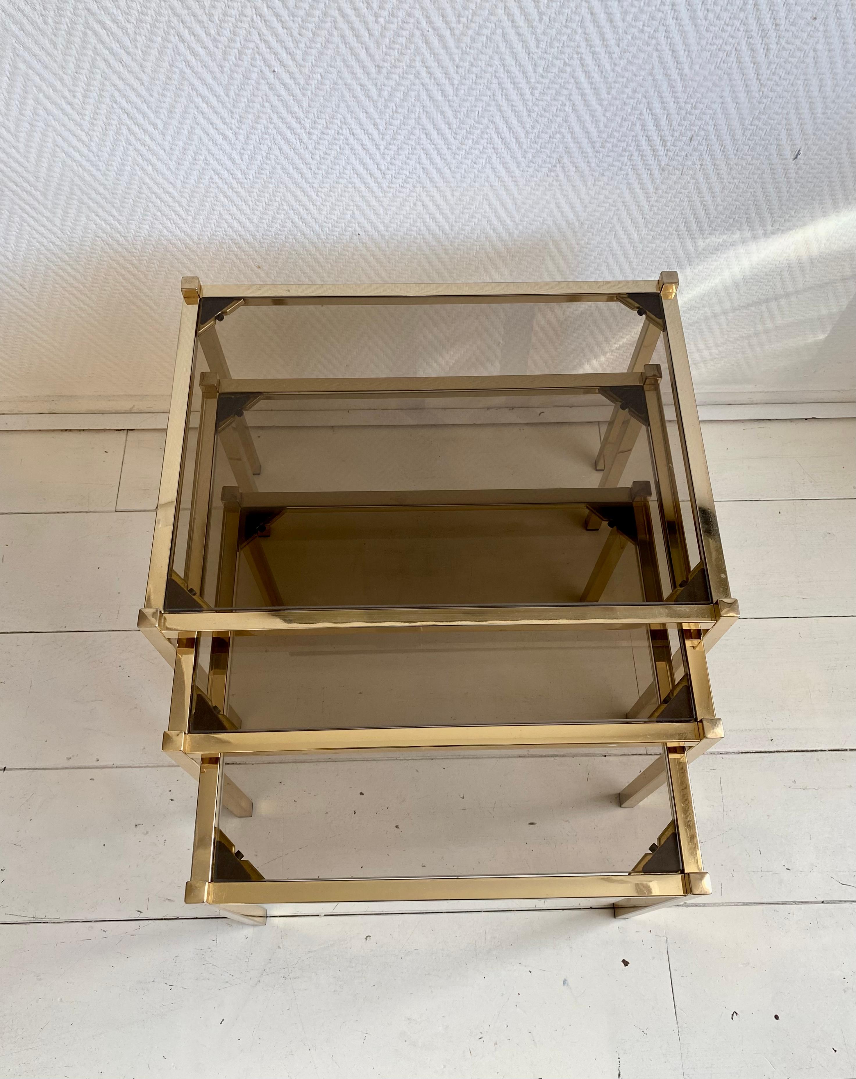 Hollywood Regency Brass Nesting Tables With Smoked Glass For Sale 1