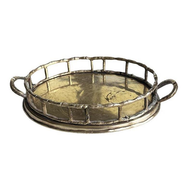Lovely petite oval-shaped brass faux bamboo tray. With a metal oblong base, the sides of this tray feature metal faux bamboo edges and handles. Made in India.

How We Would Style It:
Because of the size of this tray, (the ones we have come across in